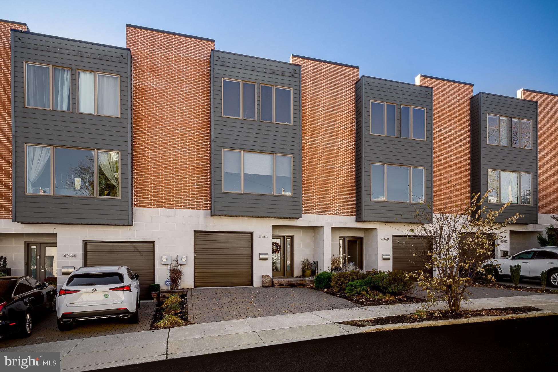 Welcome to Monastery Hill - Urban Contemporary living providing stunning panoramic views from every floor. This 3 BR/3 BA home in the highly desirable hills of Manayunk features spacious designs, custom finishes, and extraordinary rooftop. On the 1st floor a large step-down entertaining and media room leads to a lovely private deck. From there, ascend to a full open-concept entertaining floor. This floor features an ample great room, magnificent wall of glass overlooking the hills, sleek fireplace, custom built-in bar area with wine refrigerator, and extensive storage. A true Chef's Eat-In Kitchen complete the floor with Viking appliances, an island with seating for three, built-in Sub-Zero freezer drawers, and a spacious Dining Room with exquisite natural light. Upstairs is a luxurious master suite with yet another wall of glass, explosive views, custom walk-in closet, and en-suite bathroom. Two additional bedrooms, sleek stylish bathroom, and a full-sized laundry room finish this floor. Finally, ascend to the pilot house complete with wet-bar and fabulous rooftop deck. This rooftop completes the property with a steaming hot tub for those cool nights and explosive Center City skyline views. A 1-car garage, plus driveway parking for 2 additional cars finish the home, adding unbeatable convenience and great storage. This perfect location is just a short walk to Main Street, the train, dog park and everything that Manayunk has to offer. 15 minutes to Center City, easy access to transportation, highways and the suburbs. Truly an exceptional city home.