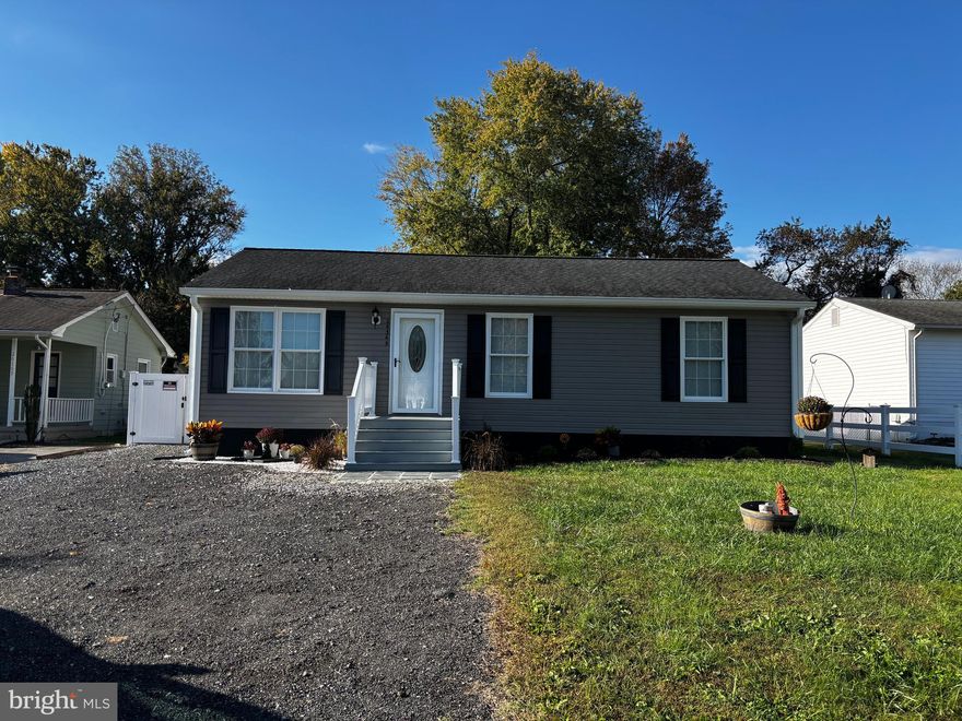 Nice rambler in a waterfront neighborhood featuring beautifully refinished hardwood flooring, tiled bathroom, brand new stainless appliances, new carpet in the bedrooms and new paint throughout.  The bathroom has a tub and a separate tiled shower.  This house is in excellent condition and ready for its new owner to move in!  The back yard in fenced in for your privacy and pets.