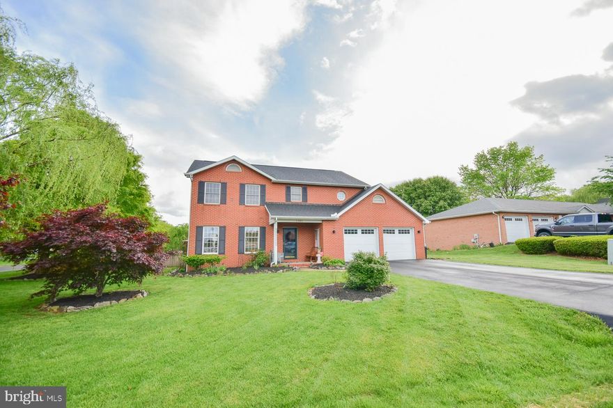 Brick Colonial Home in Foxcoft Meadow Subdivision.   This home boasts  4 Bedrooms - 2 with walk in closets, 2.5 Baths- Master has a jetted tub,  Built-in Cabinets.  2 Car Garage,  16x32 Pool with outside-enclosed pool bar with tv and mini fridge,  Hot Tub, Fenced Rear Yard, Manicured Lawn, Mature Willow, Oak, Cherry and Japanese Maple trees.  Freshly sealed driveway, new outside light fixtures and more... A full price offer will include the kegerator that's plumbed into the home bar with 2 taps and the TV over the bar. The back door has a powered Sunsetter Awning to keep you cool. Water Softner and pull down stairs in the garage with storage. Centrally located between Exit 13E  off I-81 and downtown Martinsburg, this home is nearly across the street from Rosemont Elementary School &War Memorial Park and less than a mile from the MARC Train and WVU Medical Center. Grandly perched on a corner lot in Foxcroft Meadow,  you'll find this dream home waiting...