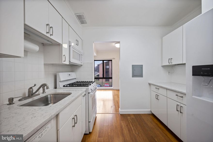 Move-in ready 2BR/1BA Condominium located in the quiet community of Long Reach. Park just steps from the stairway leading to the third floor and the door into your new home. Step inside a freshly painted home featuring an open floor plan with tons of natural light, easy care flooring, and upgrades throughout.  Walk through into the spacious living room with sliding doors onto a cozy balcony and the dining room with access to the galley style kitchen.  The newly upgraded kitchen boasts new appliances, cabinets, and sleek countertops.  Down the hall is a sizable secondary bedroom with a double closet, a remodeled full bath, and a large primary bedroom with a walk-in closet. This home is move-in ready, ideal for any new homeowner, and is located in close proximity to shopping, restaurants, and commuter routes.