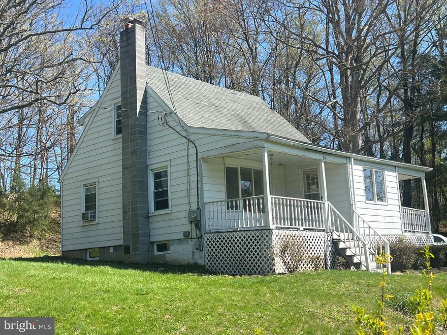 Beautiful Rural area with spacious front yard. The home is nested over 400 feet from the road. The home needs some work but will be a real jewel when spruced up. Only minutes from the Clear Spring and Interstate 70. Would make wonderful home or weekend retreat. Come see for yourself. The condition would require a cash purchase or a rehab loan.