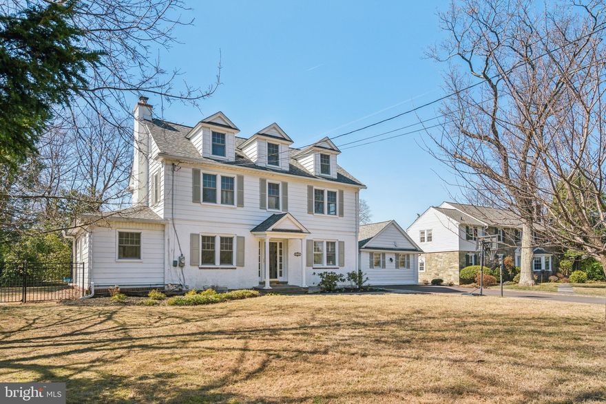 Discover the perfect blend of timeless charm and modern convenience in this classic Colonial with a twist! Located in the heart of Penn Valley on a quiet street, this freshly painted, well-maintained home with a new roof features five bedrooms and 3.5 baths. Situated on a large, level lot, this home provides ample space for all your needs. Enter through the welcoming foyer to find an expansive living room with a fireplace, leading to a bonus room ideal for a home office or library. The main floor also includes a dining room with a den/sitting area, an expansive eat-in kitchen with shaker cabinetry, a large island, and a vaulted ceiling with skylights that let in natural light. A mudroom with a separate entrance, a laundry room, and a powder room complete this level. The second floor offers a primary bedroom with an ensuite bath and walk-in closet, along with two additional bedrooms and a hall bath. The third floor features two more bedrooms and a full bath with a walk-in shower. The partially finished basement provides approximately 600 additional sq ft of living space. This outdoor oasis, with its fully-fenced, flat backyard, sparkling in-ground heated saltwater pool, and 700 sq ft covered slate patio, serves as a sanctuary perfect for hosting lively pool parties or enjoying tranquil evenings under the stars. Located in the prestigious Lower Merion School District, this property offers an unbeatable location, just steps away from the delightful town of Narberth and a short drive to Ardmore, where the allure of Suburban Square’s upscale dining and shopping await. Enjoy an effortless commute to Center City via rail or expressway, making this home a commuter's dream. Schedule a private tour today and don't miss the opportunity to make this stunning property your own.