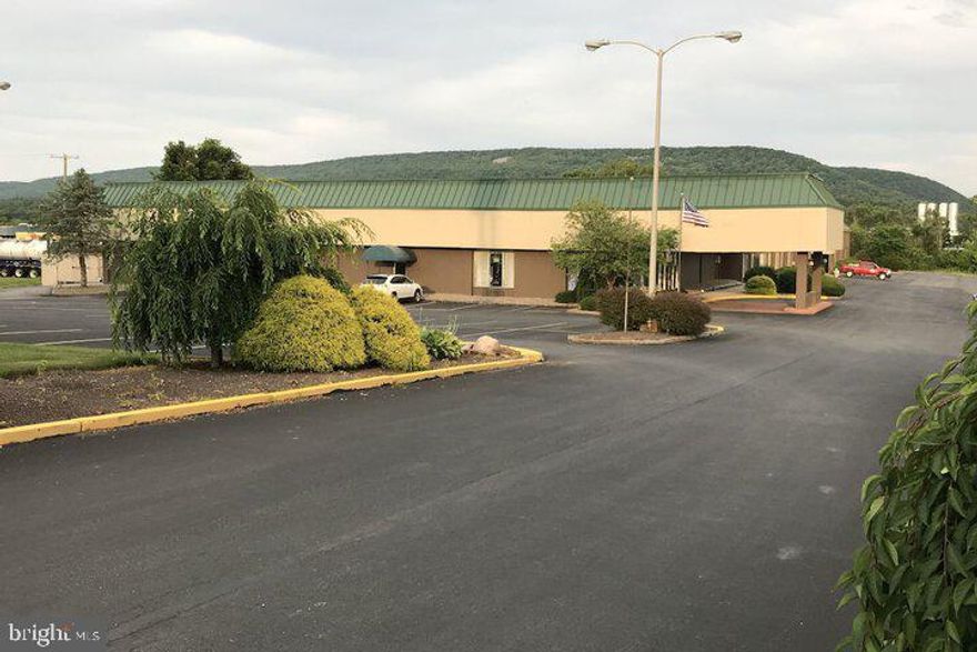 Located at the Interchange of I-80 at Route 150, this nearly 75,000 SF building on 6.5 acres in a high traffic location is currently a hotel with a full commercial kitchen and meeting rooms, but has endless possibilities as office space, a healthcare center, retail space or a variety of uses.  As a hotel, the facility features 118 rooms, a cocktail lounge, 30 person dining room, 225 seat meeting space, a business center area, guest laundry, fitness center, and indoor pool.