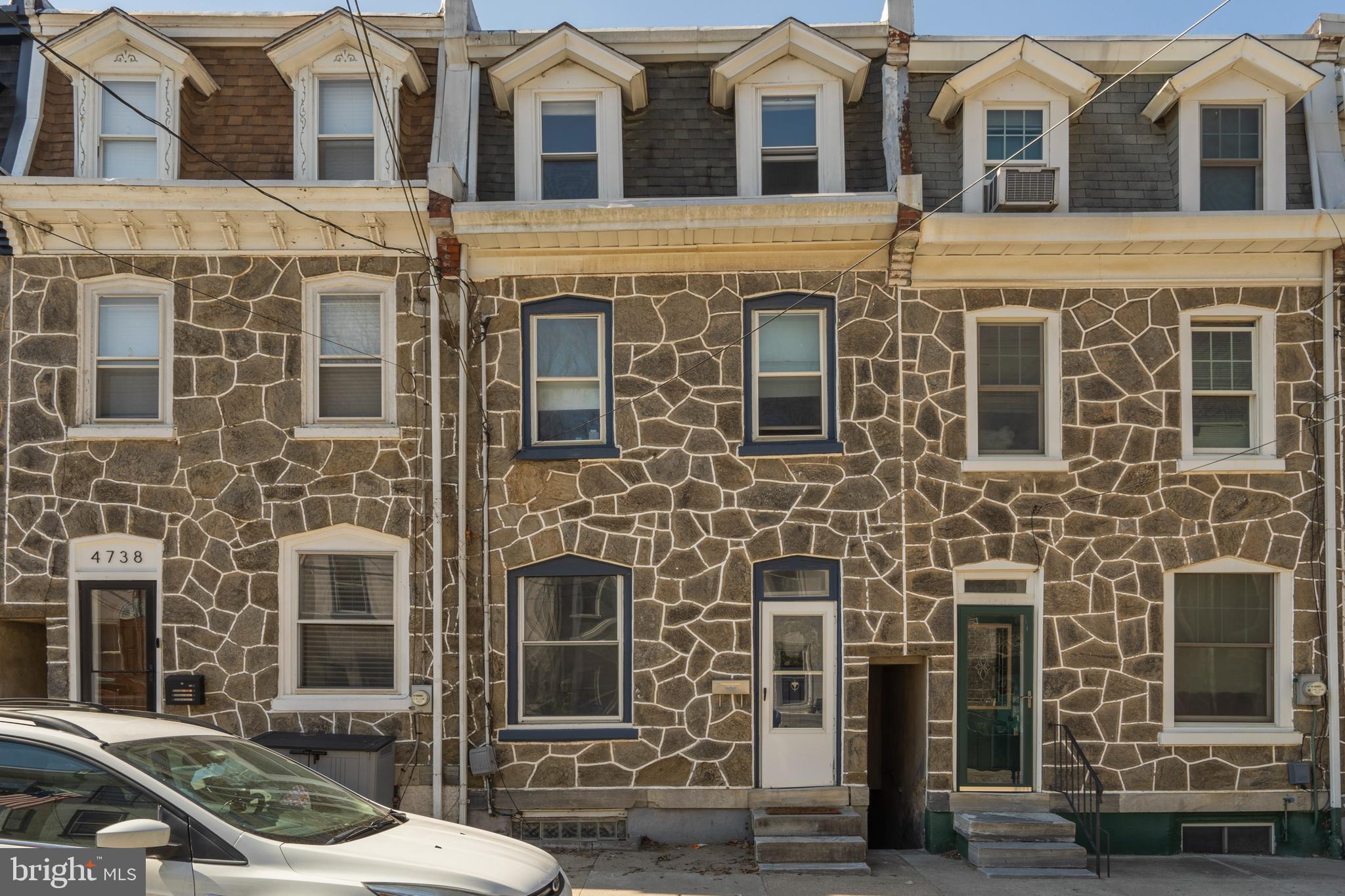 Welcome to 4740 Smick, a classic stone front Manayunk row home just minutes from Main Street and everything Manayunk has to offer! This 4 bedroom, 2 bathroom home has it all including hardwood floors, a LARGE BACK YARD from the walk-out basement, DECK off of kitchen, and CENTRAL AIR! The sunlit first floor has two great rooms for your living and dining room needs! From the minute you open the front door you notice the abundance of natural light. Step back into the beautiful kitchen which includes stainless steel appliances, granite countertops and updated basket weave tile backsplash! The deck is right off the kitchen, ideal for your morning coffee and/or your grilling and entertaining needs. The second and third floor each hold two bedrooms and one bath, optimizing the layout for flexibility. All bedrooms are spacious and have large oversized closets! Unfinished basement can be easily finished or is great for storage space. Leads out to a newly paved covered patio followed by the enormous backyard!  Home has been meticulously maintained by current owners and is move-in ready today! Perfect Manayunk location walkable to Main Street and also easy access to center city or surrounding suburbs within minutes. Ivy Ridge Train Station just a few blocks away. Take a look at this complete package today!