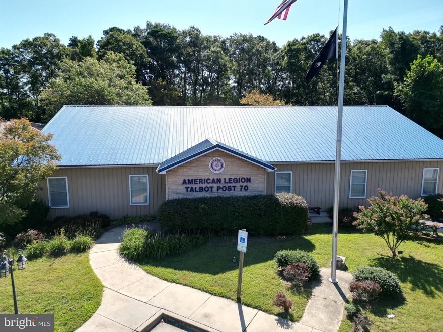Prime commercial opportunity in Easton this 4,070 +/- sqft building sits on 1.21 +/- acres and offers exceptional flexibility for a wide range of uses. Built in 2006, the structure features a durable metal exterior and roof with approximately 50 on-site parking spaces.
Currently utilized as the American Legion Post #70, the property is improved as a Class "S" Fraternal Building with a bar and dining area, large meeting room, and a commercial kitchen with walk-in refrigerator, ideal for event-based, hospitality, or food service uses.
Zoned CG (General Commercial), this location allows for numerous commercial applications, making it well-suited for restaurants, retail, office, assembly, or service-oriented businesses.
With its spacious layout, ample parking, and highly adaptable design, this property presents a unique investment or owner-user opportunity in one of Easton’s most accessible commercial corridors.