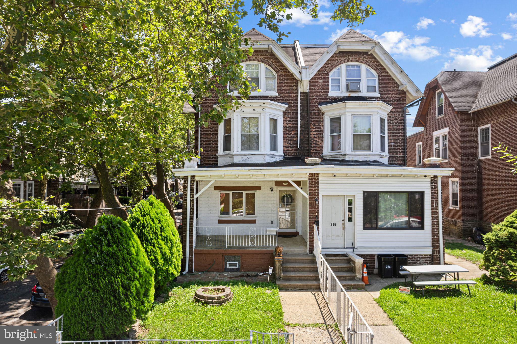Spacious and versatile, this oversized corner property in Feltonville offers rare potential for both comfortable living and rental income. The main home features five bedrooms and one and a half baths, with an additional one-bedroom, one-bath in-law suite in the basement. With interior garage access and multiple separate entrances, the layout offers great flexibility for multi-generational living or creating separate rental spaces.
The main level features a large living room, formal dining area, and an eat-in kitchen with the laundry conveniently located nearby. A half bath sits just off the rear entrance, ideal for guests when entertaining on the tiered private patio. Upstairs, five generously sized bedrooms provide plenty of space, including a large main bath with a deep soaking tub/jacuzzi that’s ready for a modern refresh. Two staircases—front and rear—offer excellent flow and flexibility for future layout adjustments.
Some updates have already been completed, while other areas offer a chance to make the space your own. Heating is forced air, and although there is currently no cooling system, the existing ductwork makes central air a feasible upgrade.
A major highlight is the finished basement, which functions as a one-bedroom apartment with its own kitchen, bathroom, and private entrance—ideal for rental income or an in-law suite. With the front and rear staircases and multiple points of entry, the remaining living spaces could be reconfigured to create additional rental units (buyer to confirm zoning and permits).
Located just minutes from Roosevelt Boulevard, Tacony Creek Park, and several public transit options, the home offers easy access to Center City, Juniata, and Hunting Park. The attached garage fits one car and provides interior entry to the home, and the sunny corner lot provides added privacy and natural light.
Whether you're looking for a spacious forever home, flexible live-work setup, or an investment with income potential, 218 E Wyoming Avenue is full of opportunity!