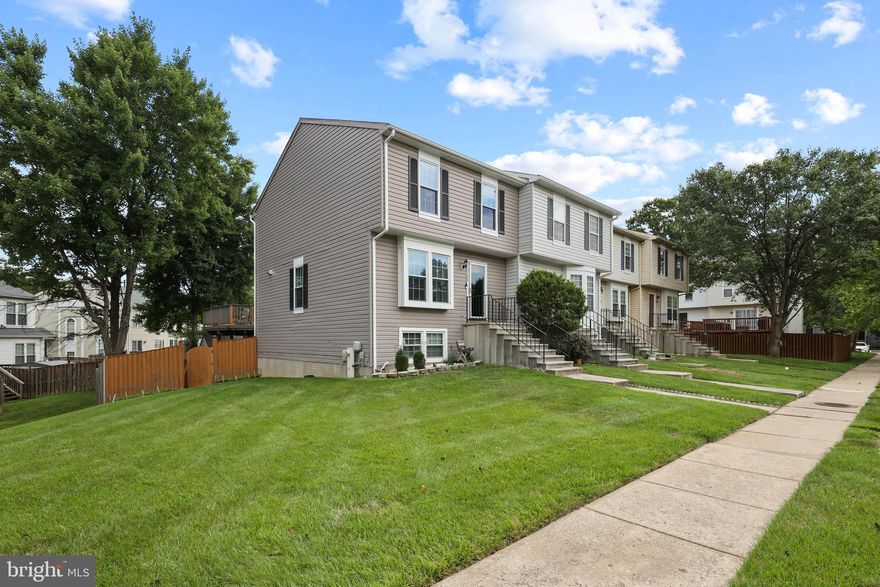 Wonderful end unit town home  ready for new owner. The main level of the home features hardwood floors throughout. A large family room is  located just off the dining area and kitchen. The kitchen includes newer stainless appliances,, reach in pantry, corian countertops and ample cabinet space. Sliding doors off the back of the home lead to a large deck overlooking a fully fenced back yard. Perfect for entertaining. The upper level has its very own primary suite with a full bathroom. A second and third bedroom are located down the hall along with a second full bathroom on the upper level. The lower level has a large finished multipurpose area. This could be a second family room, rec-room or study. A large storage are and laundry are located on the lower level as well as a half bath for your convenience. The lower level is walk out level and features sliding glass doors leading to a large patio and the back yard. The home has recently replaced windows and HVAC. Convenient to Baltimore, route 70, 695 and 95. Do not wait to come se this wonderful home.