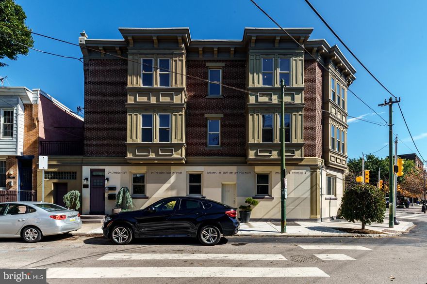 Experience the privilege of owning an extraordinary piece of real estate located on the most coveted corner in Passyunk Square, directly across from the vibrant singing fountain. This three-story, double-wide corner property boasts over 4,700 square feet of pristine living space, exuding charm and curb appeal. Offering three separate units and windows that surround the building, this property presents a rare opportunity for investment or personal use.
The property is all self-contained and zoned for commercial mixed use, making it perfect for diverse business opportunities and residential living. It is currently owner-occupied, with a flexible commercial space on the first floor that connects to the basement, and two exceptional and expansive apartments on the upper floors. The design is beautiful, thoughtfully crafted by an artist and an engineer with meticulous attention to detail.
On the first floor, there is a generous 1,700 sq. ft. versatile, commercial space. Currently configured as an art studio and exhibition area, this open and spacious environment features two separate entrances, surrounding windows for ample natural light, a powder room, and two bonus rooms for additional storage or creative use.
The 2nd floor apartment offers a luxurious living experience with 1,500 sq. ft., featuring 2 bedrooms and 2 bathrooms. It includes an expansive kitchen with 42-inch cabinetry and quartz countertops, spacious living and dining rooms with high ceilings and hardwoods floors, generous sized bedrooms for optimal privacy, a huge walk-in closet with custom built-ins, two nicely updated bathrooms and in-unit laundry.
The 3rd floor apartment showcases 1,500 sq. ft. of light-filled living space, including 3 bedrooms and 2 full bathrooms. It features an open-floor plan, many windows with some nice Center City skyline views, large eat-in kitchen, hardwood floors throughout, updated baths, in-unit laundry and the potential for an unbelievable roof deck with 360-degree unobstructed views.
Additional features include an enormous full basement with high ceilings that offers ample space for storage and houses mechanicals.
This fabulous property combines art and engineering, reflecting the care of its current owners. Every detail is crafted for both aesthetic appeal and functional excellence, ensuring a unique living and working experience. The location is second to none! Who will seize this one-of-a-kind opportunity? Make your appointment today.