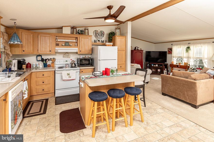 Welcome home to this beautifully maintained, move-in-ready gem where you won’t need to change a thing! Enjoy bright, spacious living throughout! The home features a primary bathroom with a convenient connection to the laundry room, making everyday living effortless. Located just minutes from the beaches, this home offers the perfect blend of comfort and coastal lifestyle. Within a community rich with amenities, you’ll have access to a vibrant clubhouse with weekly activities, an indoor saltwater swimming pool, dog park, bocce ball court, and easy access to the Lewes–Georgetown Walking Trail. Residents also receive a yearly pass to enjoy the outdoor pool at Colonial East! Recent upgrades include a brand new washer and dryer installed 1/17/26, new carpet throughout, as well as new front door and door frame installed in 2023. This is easy living at its finest — just unpack and start enjoying everything this community has to offer!