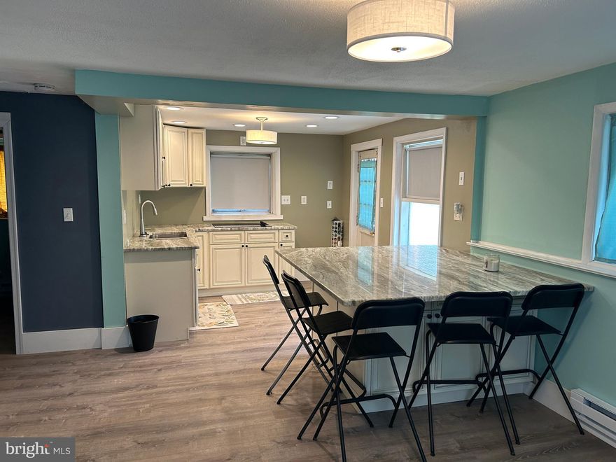 Tons of work already done in this 4 bedroom 2.5 bath split level! Brand new kitchen with granite counter tops and huge granite island, new  flooring and trim , new dual zone electric baseboard heat. Newer water heater. Tons of space with lots of natural light, Add your finishing touches to make it yours. All this and a large backyard with a detached 2 car garage. House being sold as is .