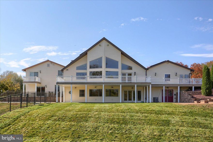 As you walk through this home, it just seems to never end and opens to new areas that make you say “Wow!”.  The kitchen itself is a true work of art that allows for lots of space to cook and entertain your guests at the huge island, all at the same time. The kitchen boasts 2 sinks, a large main dishwasher as well as a set of 2 smaller stacked dishwashers in case you need more dish space. There is also an extra capacity ice maker next to them so you and your guests never run out. Propane gas cooking and an extra-large Sub-Zero refrigerator round it all out . You will love all the windows looking out at the backyard that connects to the creek. And we know that houses that sit on the creek are very few, and houses this nice on the creek are rare. Come be in awe of not only the massive amount of space (that includes an in-laws area) giving the possibility to bring multiple generations together to live, but also the beautiful finishes the home has to offer. There is lots of car parking in the garages as well as the driveway for lots of people. Solar panels have been installed to benefit the earth and save money on your electric bill, and the large deck is waiting for you to enjoy. Oh yeah, this is a double lot with the possibility to turn the second lot  into a building lot. Call your agent today to see this prize that is minutes to the downtown as well as the schools.