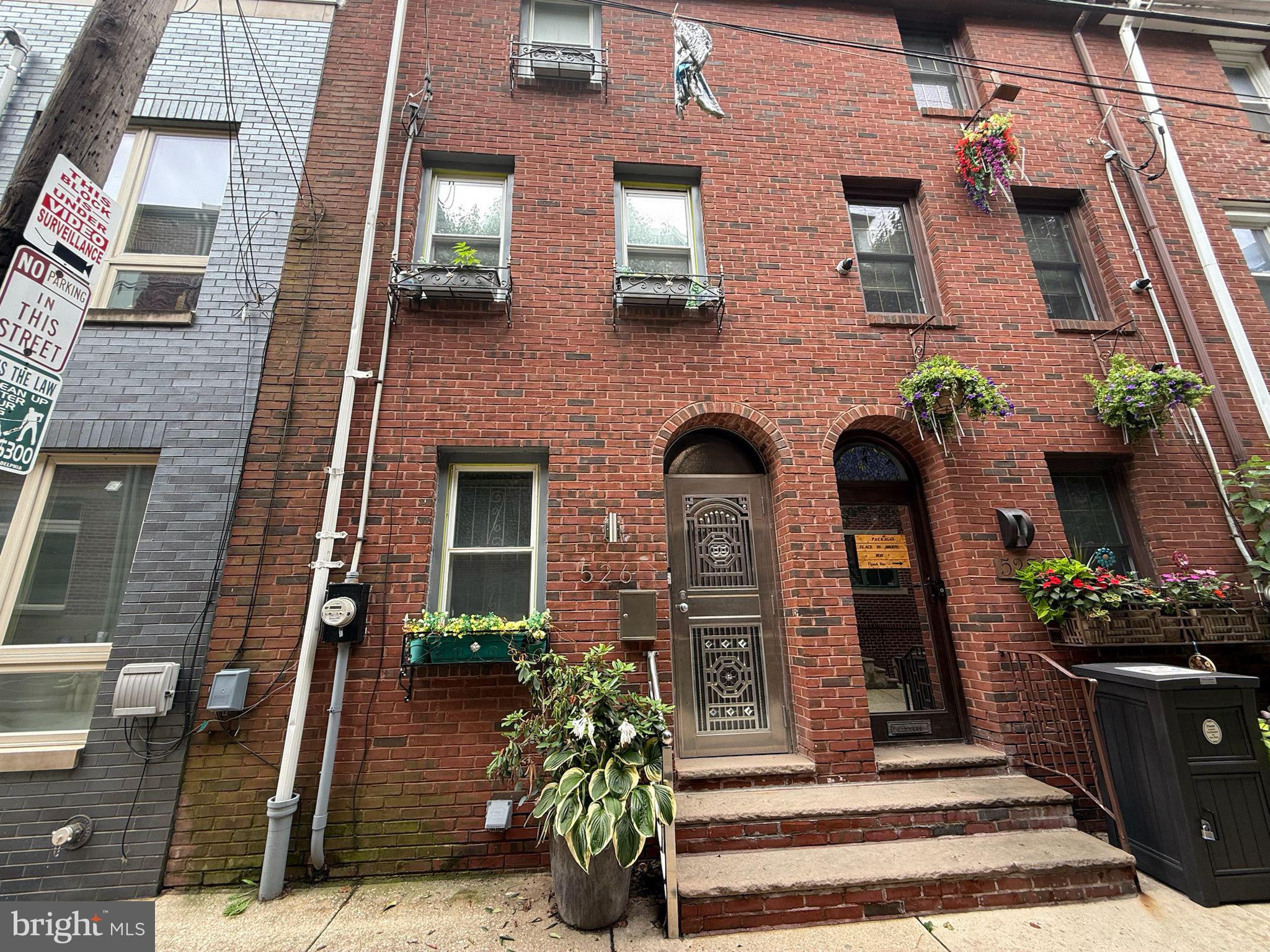 Charming 3-bedroom, 1-bath brick townhome in the heart of Queen Village! This 1,164 SF interior home
offers a fresh, bright living room with a cozy gas fireplace, an updated bathroom, and a unique spiral staircase. The primary bedroom features a vaulted ceiling, adding character and space. Enjoy the convenience of laundry in the basement and a modest backyard. Nestled in one of Philadelphia’s most sought-after neighborhoods, you're steps from local cafes, parks, and historic charm. A perfect blend of comfort and city living. Sold As-Is