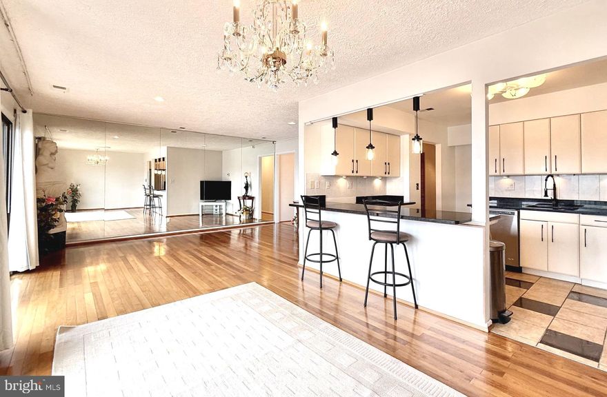 Experience the epitome of waterfront elegance in this stunning, meticulously renovated 1,439 sq. ft. second-floor residence. Strategically positioned to offer a breathtaking panoramic view of the widest expanse of the harbor, this home provides a “front-row seat” to the most spectacular water vistas in the community. Step across seamless, rich hardwood flooring that gracefully flows throughout every square inch of the home, including the walk-in storage room. The residence has been thoughtfully reimagined with a designer’s eye, featuring a contemporary kitchen and two fully modernized bathrooms. The layout is optimized for both daily living and effortless entertaining. Bathed in natural light, the open-concept living area draws your gaze directly to the shimmering harbor through expansive windows. Two additional full, high-end bathrooms are designed with a clean, modern aesthetic and luxurious appointments.
This is more than just a home; it’s a gateway to the water. A private boat slip conveniently connects your living room to the open water, allowing you to embark on your water adventures in minutes. Enjoy the peace of mind that comes with assigned parking and a serene, quiet neighborhood atmosphere, complemented by ample open parking.

Rarely does a unit of this caliber, with its specific harbor vantage point, become available. Schedule your private tour today to witness the sunset over the water from the comfort of your own living room.