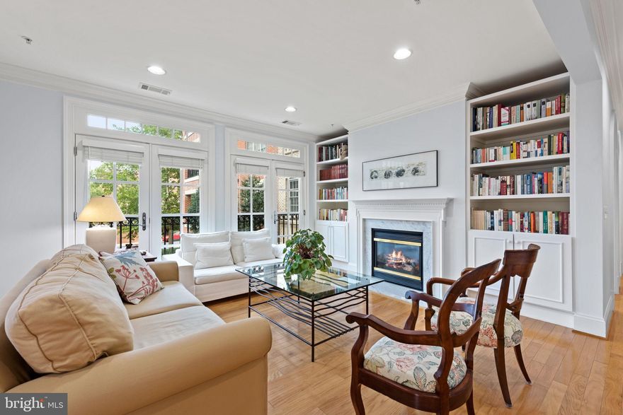 Welcome to 540 Second Street #205 – a sanctuary of comfort nestled within the coveted community of Liberty Row, in historic Old Town Alexandria. This exquisite residence offers a harmonious blend of elegance and convenience, presenting a lifestyle that seamlessly intertwines modern living with timeless allure. Embrace the privilege of residing mere moments from the Potomac River waterfront. A beautiful scenic walking trail is a stunning canvas across all four seasons and the river's waters will become a tranquil haven for those seeking respite from the urban pulse. Step inside this captivating condo and be greeted by a thoughtfully designed layout adorned with impeccable details throughout. An abundant infusion of natural light bathes the interior, further accentuating the rich hardwood floors and a neutral palette that effortlessly accommodates any personal style. Discover a realm of refined comfort within the realm of 2 bedrooms and a versatile den, complemented by 2.5 meticulously appointed bathrooms. The heart of this home is the living room – a space that beckons you to unwind by the gas fireplace, surrounded by built-in shelves that stand as a testament to both form and function. French doors invite you to a private balcony, where contemplative moments and vibrant sunsets become part of your daily routine. Prepare culinary delights within the well-equipped kitchen, with granite counters, stainless steel appliances, and an abundance of storage space for all essentials. A grande primary bedroom awaits, offering a walk-in closet and an ensuite bath that epitomizes luxury. This haven of comfort ensures your mornings begin with a sense of tranquility and rejuvenation. Ease and convenience are seamlessly integrated into your lifestyle, courtesy of 2 generously sized and assigned underground parking spaces. 
The allure of this residence extends beyond its walls, as trendy “main drag” King Street beckons – a vibrant avenue offering a plethora of dining and shopping options that cater to every palate and preference. Commute effortlessly to the heart of Washington, D.C., as the capital city lies a mere 20 minutes away, granting you access to the epicenter of culture and commerce. Relish a life free of maintenance concerns, as association fees envelop every aspect of your living experience, affording you the freedom to revel in the pleasures of Liberty Row. Experience the synergy of location, luxury, and lifestyle – a symphony orchestrated at 540 Second Street #205. Your next chapter awaits; seize the opportunity to make it truly extraordinary.