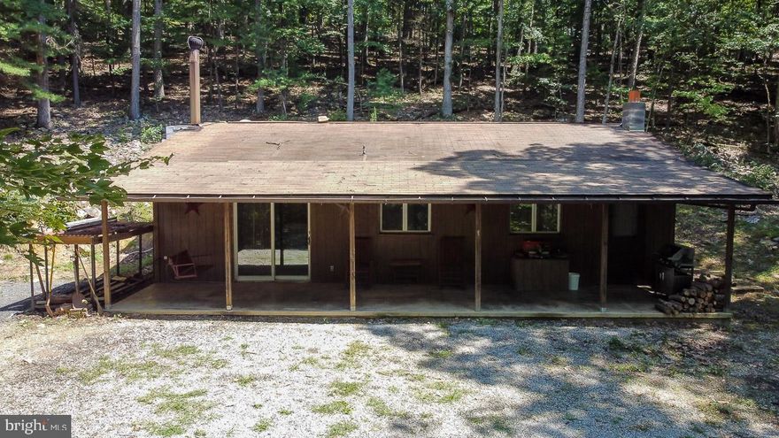 This quiet mountain retreat sits on 10 total acres consisting of  2 separate 5 acre tracts.  Come enjoy the large front porch on this 1 bedroom, 1 bath cabin with over 1000 square feet of living space.   Remodeled kitchen and bath.  New mini split unit for heating and cooling.   Cabin comes mostly furnished