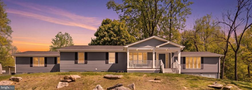 Coming Soon — A Rare Opportunity in South Berkeley!

Perched gracefully atop 1.59 acres in the highly desirable Arden District, this exceptional residence offers a level of craftsmanship and thoughtful design that is increasingly hard to find.   Spanning nearly 5,000 finished square feet, this beautifully maintained home blends generous scale with refined comfort, all set against a backdrop of peaceful mountain views.

The main level encompasses approximately 3,000 square feet and welcomes you with an airy, open-concept layout designed for both everyday living and effortless entertaining.   A striking vaulted ceiling anchors the expansive living room, while the gourmet kitchen serves as the true heart of the home as it’s generously sized, beautifully appointed, and perfectly suited for gatherings both large and small.   A formal dining room adds a touch of elegance, and the main-level primary suite offers a private retreat, complemented by three additional spacious bedrooms ideal for family or guests, two more nicely-conditioned full bathrooms, and a convenient main level washer and dryer.

The fully finished lower level expands the home’s versatility, featuring a complete second living area with its own kitchen, two additional bedrooms, a full bath, and a private entrance.  This all lends itself to an ideal arrangement for an in-law suite, extended guests, or flexible multi-generational living.  The outdoor living is just as inviting.  Enjoy quiet mornings on the welcoming front porch, where mountain vistas stretch into the distance, or host evenings on the expansive rear deck with gazebo and fire pit that overlooks the beautifully designed landscaping and wide, open yard that includes fencing.

Beyond its beauty, this home delivers unmatched convenience.   Ideally located just off I-81, it offers easy access to major commuter routes and is only minutes from the VA state line, Procter & Gamble and Amazon facilities, as well as shopping, dining, and recreational amenities.   Dulles International Airport is approximately 75 minutes away.

Every detail of this home reflects care, quality, and intention, creating a property that stands apart—offering not just space, but a setting that feels both private and connected.  This is a remarkable home in an exceptional location.   A rare offering of space, setting, and versatility, this distinguished residence delivers an elevated lifestyle in one of South Berkeley’s most sought-after locations.  Book your showing today!