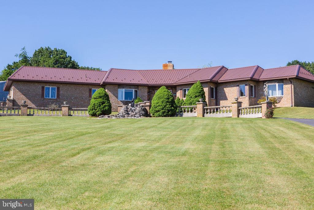 ONE OF A KIND - PHENOMINAL COMES TO MIND!!! This one owner property is a must see to begin to appreciate the value and to understand the love and pride that comes with it. When entering the property you will take the long private lane passing by the pasture and stream to an opening with a marvelous view of the ranch home and red barn. Exiting the property will only want to be done to see the million dollar views while driving down the lane, no other reason to leave this private, secluded, serene property. This is only some of what the property offers: Million Dollar Plus Views, Over 75 Acres, Hunting Ground, Fields for Crops, Pasture, Workshop, Barn, Possible Subdivision of 2 Building Lots, Stream, Fishing Pond, Swimming Pool, Fruit Trees, Pavilion Picnic Area, Seclusion, All Brick Ranch 3 Bedroom 2 1/2 Bath Home, Circular Driveway, Fountain and So Much More! If You Are In Search Of Your Forever Home, Ranch/Farm or Summer Retreat LOOK NO FURTHER! The possibilities on this property are endless. The home is appointed with fine woodwork all handcrafted in the workshop on premise, granite kitchen with solid hardwood cabinets, living room with fireplace, separate dining room, mudroom with laundry and a full unfinished basement. PLEASE SCHEDULE YOUR PRIVATE TOUR TODAY - Be respectful of the current owners and only go up the lane if you are scheduled with an agent to do so!