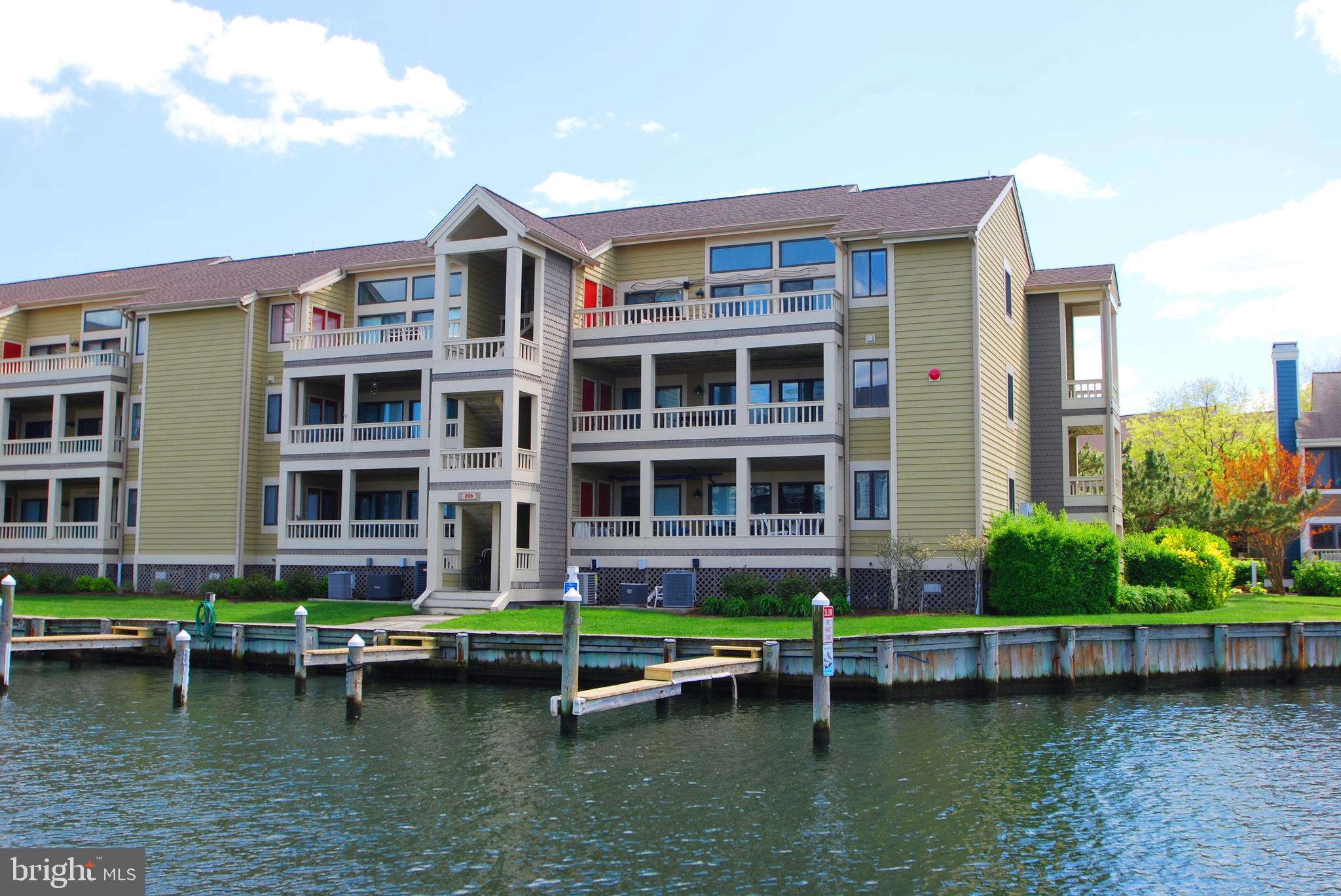 What you have waited for; Bay view, beautiful first floor remodeled 2 bedroom unit, with boat slip #2 just steps from your deck in the fabulous community of Heron Harbour Isle. Enjoy the best that resort living can offer with lots of amenities and fantastic bay views from your deck. Nicely decorated interior includes; remodeled kitchen with Corain counter tops, remodeled bathrooms, all hard surface wood & tile flooring, new windows, new Heating/AC systems, and updated appliances. Ready to enjoy this season. Open floor plan living area with double slider doors to large water front deck with steps from deck to dock and boat slip. Master bedroom features private bath with new walk-in shower and slider door to deck. Second bedroom features new door to deck, bay view window and access to 2nd updated bathroom. A perfect place to enjoy all types of water front living; boating, kayaking, crabbing, fishing and much more. Condo Association newly installed dock finger piers. Condo community offers kayak storage area and floating dock. Fabulous amenities: 2 outdoor pools-lap & recreation pool, year round indoor pool, fitness center, sauna, outdoor tennis & club house. Close to beach, shops, entertainment & Northside Park. Wonderful resort living and a great price!