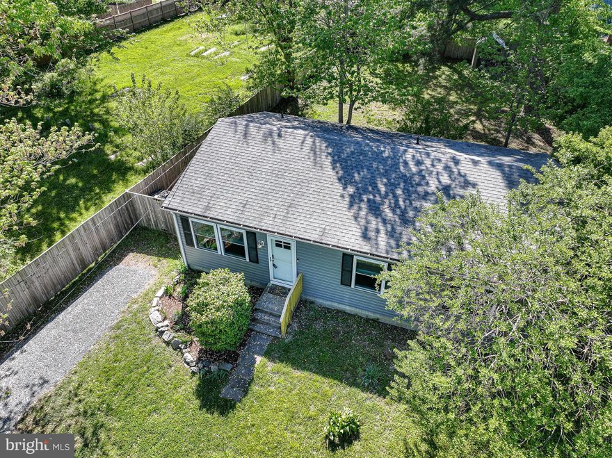 Welcome to this beautifully updated cottage in the heart of St. Michaels—where modern comfort meets Eastern Shore charm. Perfectly situated within walking distance to the town’s shops, restaurants, Rails to Trails, and the renowned Maritime Museum, this single‑level home offers both convenience and a peaceful, private setting. Sitting on nearly a quarter acre, the property features a fully fenced backyard with a 6‑ft wood privacy fence, creating an ideal space for outdoor living, pets, or quiet relaxation. Inside, the home presents like new with thoughtful upgrades throughout, including hardwood flooring, recessed lighting & fresh interior paint. The kitchen and bathrooms shine with quartz countertops, tile flooring, and modern finishes. The kitchen is equipped with stainless steel appliances, new cabinetry, quartz countertops, and an under‑sink water filtration system. A front‑loading Samsung washer and dryer and a 50‑gallon water heater add to the home’s move‑in‑ready appeal. Offering 3 bedrooms and 2 full bathrooms, this well‑designed floor plan provides comfortable single‑floor living in one of the Eastern Shore’s most desirable towns. Whether you’re seeking a full‑time residence, a weekend retreat, or an investment opportunity, this St. Michaels gem delivers style, convenience, and exceptional value. The driveway access is on N Talbot St. Please see agent remarks.
