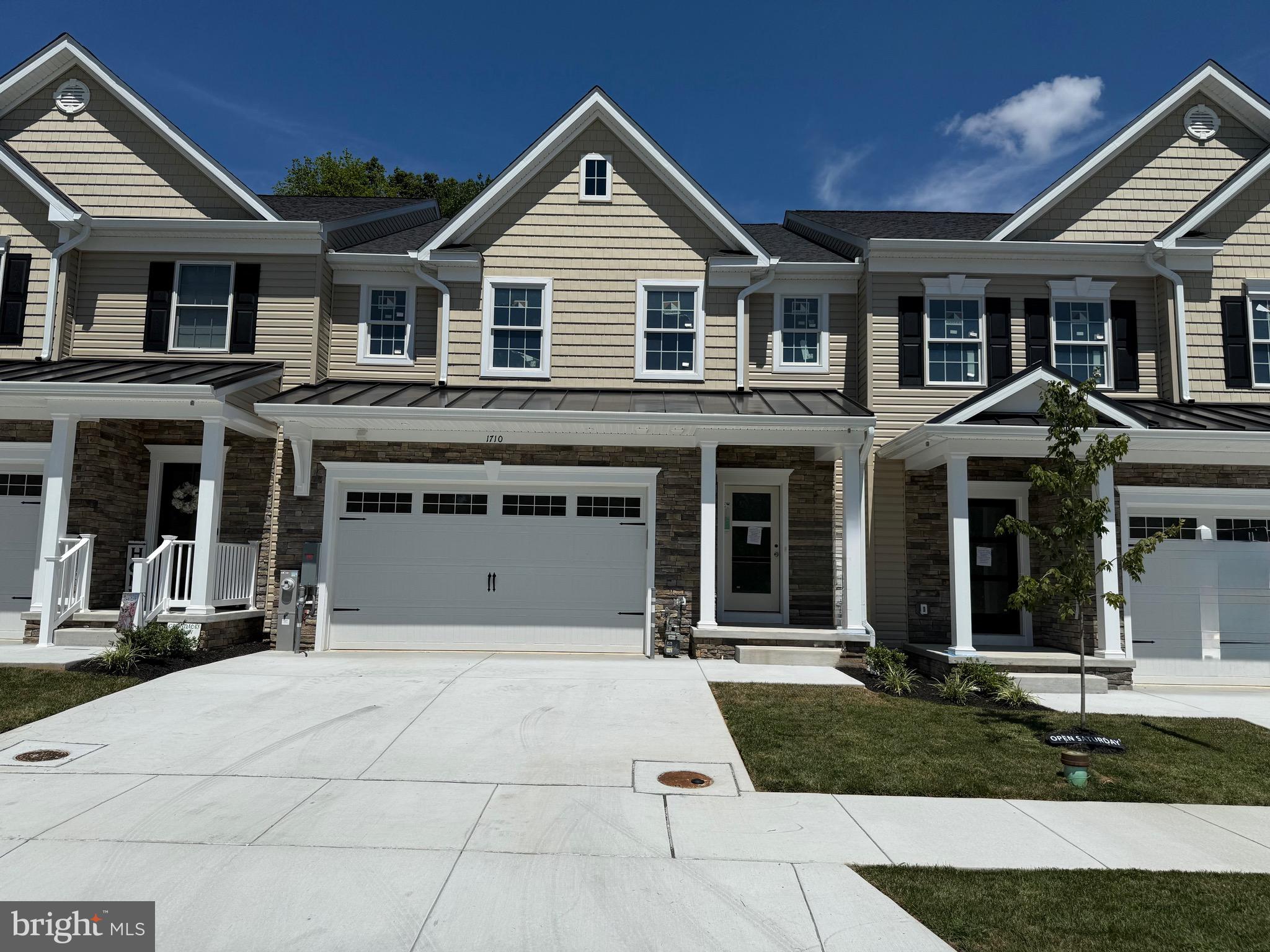Open House This Saturday from 12-3 pm. Stop by 1714 Botanical Ct to tour this home! Eldersburg's new Doroly Gardens 55 & older upscale community will have 28 units when completed. Quick Delivery Interior and End Units Available! This home is close to completion! Kitchen cabinets installed, Quartz Counters in kitchen & baths installed! Just needs hardwood steps stained & poly-urethane. Custom built with quality materials. Quality Andersen tilt windows, double hung with full screens, Andersen sliding door and 2x 6 exterior walls! Quality custom built with cultured stone, cedar look vinyl siding exterior accents. Two car garage that is painted, dry walled & insulated includes a garage door opener & exterior keypad. Upon entering the home you will find solid oak 5" wide hardwood floors in foyer, kitchen, great room & primary bedroom. In the foyer is located a double coat closet, powder rm with taller soft close vanity with a Quartz top. Conveniently located mudroom between garage & kitchen also includes a separate first floor laundry rm with large ceramic tiled floor & utility sink. The spacious kitchen features a fabulous open floor plan, an island with breakfast bar & pendant lighting, gorgeous Quartz counters, soft close white shaker cabinets w/roll out trays, trash/re-cycling drawer plus ceramic tile backsplash and under cabinet LED lighting. The stainless steel Whirlpool appliances include: gas range, dishwasher & microwave, plus garbage disposal, beautiful marble countertops. Great room with vaulted ceiling, ceiling fan, windows with transoms above and slider to rear covered porch. The 1st floor owners bedroom is accented with a tray ceiling and includes an ensuite full bath, large ceramic tiled floor & shower, taller double vanity with soft close features, Quartz counters and spacious shower. Stairs to second floor feature oak stair treads, white risers, oak railings with wrought iron spindles. Second floor contains a huge loft area that overlooks the great room, with oak rails & wrought iron balusters, hardwood flooring & ceiling fan. Terrific for an office or second floor family room, plus 2 spacious BR's with hardwood floors & ceiling fans, second floor spacious full bath with taller double vanity, beautiful Quartz top, with tub & commode are in a separate room. Also on the second floor you will find a large storage/mechanical room featuring the second zone heat pump with natural gas back-up heat. Lower level is an open full unfinished basement with egress window & full bath rough-in, wet bar rough-in too. Basement could be finished at an additional cost to Buyer. The Trane HVAC system features two separately zoned heat pumps with natural gas back up & CAC. Condo fee includes lawn care, trash service, street lights, snow removal & exterior mulching. See other completed interior unit at 1716 Botanical Ct with video and QUICK DELIVERY END UNITS FOR SALE at 1712 and 1714 Botanical Ct. BUILDER is OFFERING $5,000 TOWARDS BUYERS CLOSING COSTS WITH USE OF BUILDER RECOMMENDED LENDER ONLY, WITH FULL PRICE OFFER! TAXES LISTED ARE FOR LOT ONLY!