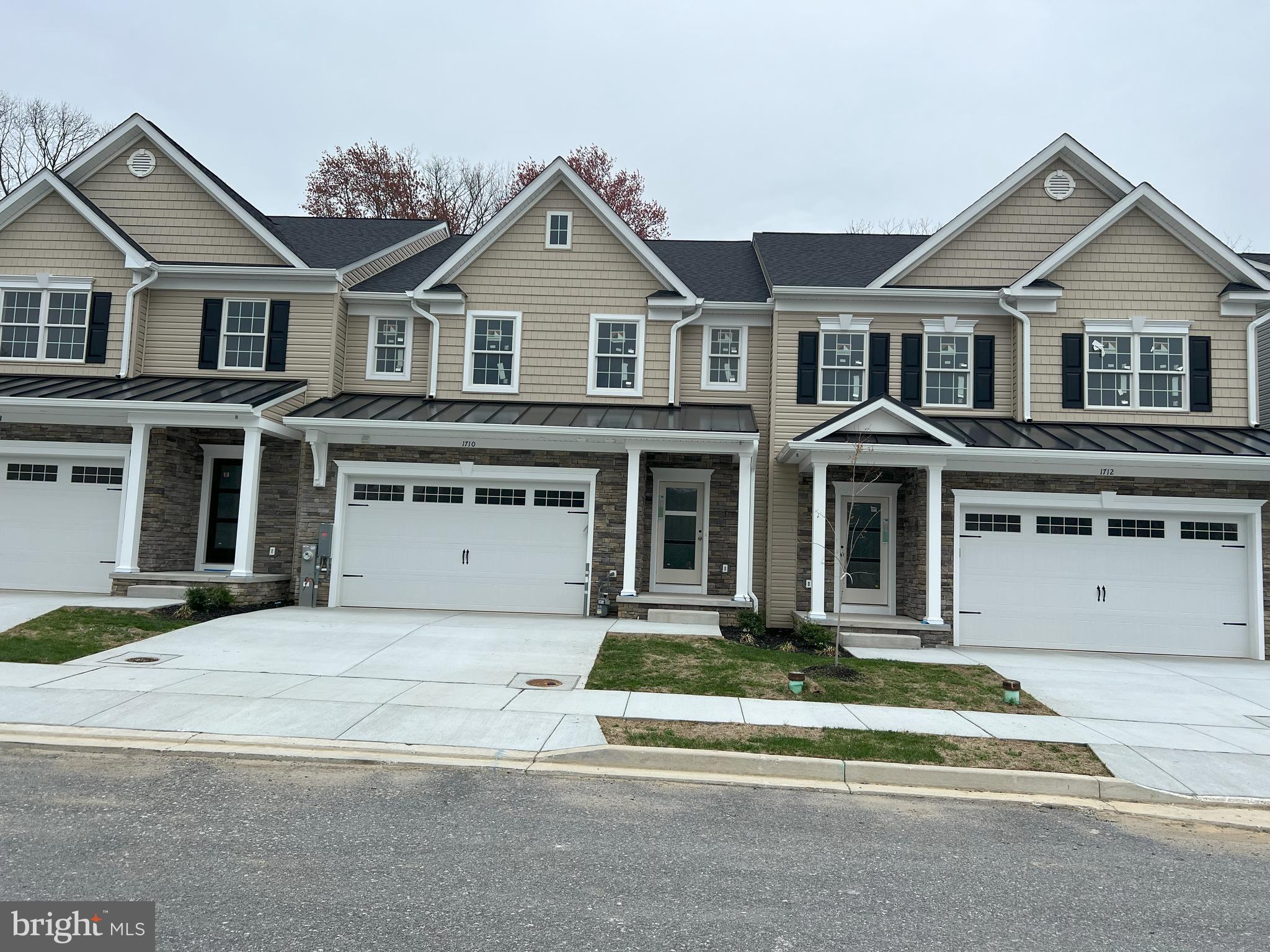 Open House this Saturday from 12-3 pm. Stop by 1716 Botanical Ct to tour this home! Eldersburg's new Doroly Gardens 55 & older upscale community will have 28 units when completed. Quick Delivery Interior and End Units Available! This home is close to completion! Custom built with quality materials. Quality Andersen tilt windows, double hung with full screens, Andersen sliding door and 2x 6 exterior walls! Quality custom built with cultured stone, cedar look vinyl siding exterior accents. Two car garage that is painted, dry walled & insulated includes a garage door opener & exterior keypad. Upon entering the home you will find solid oak 5" wide hardwood floors in foyer, kitchen, great room & primary bedroom. In the foyer is located a double coat closet, powder rm with taller soft close vanity with a marble top. Conveniently located mudroom between garage & kitchen also includes a separate first floor laundry rm with large ceramic tiled floor & utility sink. The spacious kitchen features a fabulous open floor plan, an island with breakfast bar & pendant lighting, gorgeous marble counters, soft close white shaker cabinets w/roll out trays, trash/re-cycling drawer plus ceramic tile backsplash and under cabinet LED lighting. The stainless steel Whirlpool appliances include: gas range, dishwasher & microwave, plus garbage disposal, beautiful marble countertops. Great room with vaulted ceiling, ceiling fan, windows with transoms above and slider to rear covered porch. The 1st floor owners bedroom is accented with a tray ceiling and includes an ensuite full bath, large ceramic tiled floor & shower, taller double vanity with soft close features, marble counters and spacious shower. Stairs to second floor feature oak stair treads, white risers, oak railings with wrought iron spindles. Second floor contains a huge loft area that overlooks the great room, with oak rails & wrought iron balusters, hardwood flooring & ceiling fan. Terrific for an office or second floor family room, plus 2 spacious BR's with hardwood floors & ceiling fans, second floor spacious full bath with taller double vanity, beautiful marble top, with tub & commode are in a separate room. Also on the second floor you will find a large storage/mechanical room featuring the second zone heat pump with natural gas back-up heat. Lower level is an open full unfinished basement with egress window & full bath rough-in, wet bar rough-in too. Basement could be finished at an additional cost to Buyer. The Trane HVAC system features two separately zoned heat pumps with natural gas back up & CAC. Condo fee includes lawn care, trash service, street lights, snow removal & exterior mulching. See other completed interior unit for sale at 1716 Botanical Ct with video and quick delivery end units for sale at 1712 and 1714 Botanical Ct. BUILDER is OFFERING $5,000 TOWARDS BUYERS CLOSING COSTS WITH USE OF BUILDER RECOMMENDED LENDER ONLY, WITH FULL PRICE OFFER! TAXES LISTED ARE FOR LOT ONLY!