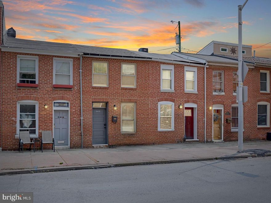 Welcome to this beautifully update townhome in the vibrant Canton neighborhood of Baltimore City! Full of charm and modern touches, this home showcases an open-concept main level with a stunning exposed brick wall, rich hardwood floors, and a spacious dining area highlighted by sleek concrete flooring, perfect for entertaining. The gourmet kitchen is a chef’s dream, featuring Quartz countertops, stainless steel appliances, shaker-style soft-close cabinetry, and a decorative tile backsplash.  A stylish powder room and access to a private fenced rear patio complete the main level. Upstairs, the sunlit primary suite offers a double-door closet, beautiful hardwood floors,  and a contemporary en-suite bath, while the second bedroom impresses with vaulted ceilings, double closets, and hardwood flooring. The second level is complete with a full hallway bathroom. Enjoy sweeping city views from the rooftop deck, with hall access, ideal for relaxing and taking in the scenery. As an added bonus, this home also comes with 2 years left on the CHAP Tax Credit!! Just minutes from Patterson Park, the Inner Harbor, and the National Aquarium, with easy access to I-95, I-695, and I-83 for convenient commuting in any direction.