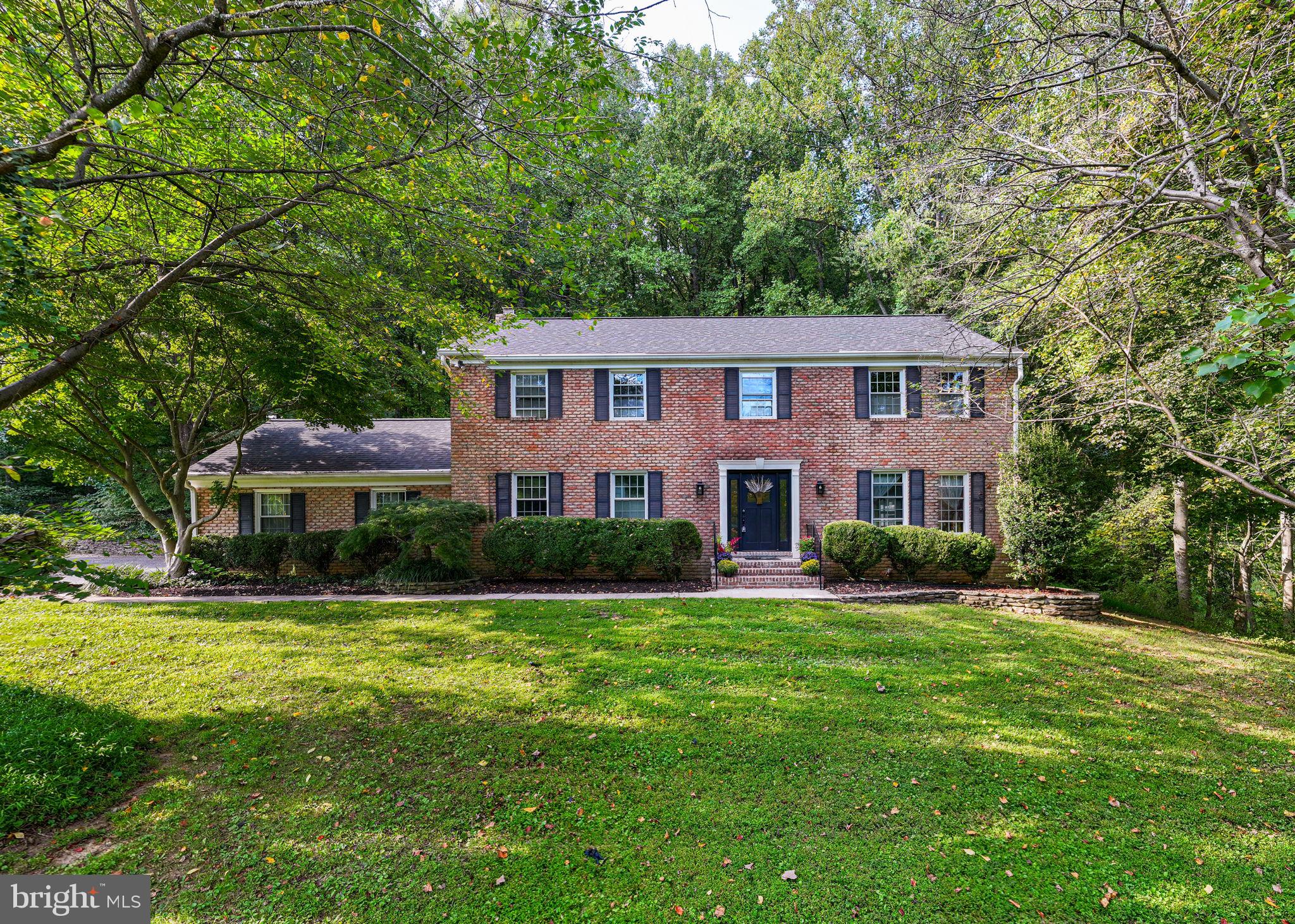 Now available in the sought-after community of Honeysuckle Hill in Glen Arm, Maryland, is this gracious four-bedroom colonial home nestled on 1.35 acres of park-like beauty. A new lifetime roof was installed on 10/23; the furnace and AC were replaced in 2022, new drain fields in 2018, and new carpets in 2023. Just steps away from Loch Raven Reservoir, this home features hardwood floors and an open kitchen family room with a raised-hearth brick fireplace. Crown molding, chair railing, wainscoting, built-ins, and
recessed lighting are present throughout the home. On the main level, you will find a grand entrance foyer,
a living room, a formal dining room, a gourmet kitchen, a half-bathroom, and a large family room. The large owner's suite on the upper level has an attached bathroom with dual vanities, a Jacuzzi tub, and a stand-up shower. Three large bedrooms and a full bathroom complete the upper level. Dual-zoned air conditioning. The finished basement can be a den, family room, office, or anything you desire. Beautifully situated on a 1.35-acre lot, this home has plenty of curb appeal. In the rear of the home is a large composite deck, a stone patio, and a flat-level yard. The home is yards away from Loch Raven Reservoir and the walking trails to Loch Raven Dam. Enjoy the tranquility of a home in the middle of nature just minutes away from shopping, restaurants, fruit stands, farms, local creameries, and the Beltway. Take a tour of this home today!