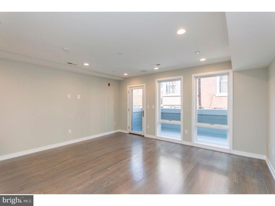 This stunning new construction building in Graduate Hospital offers luxurious space at a great value. Enter your brand-new home and immediately notice the great natural light from the large windows. Step across the fine hardwood flooring to your modern kitchen, featuring all brand new Samsung appliances, quartz counter tops with bar seating, and ample cabinet space. NEST Thermostats, hard-wired speakers in the ceiling and outdoor spaces, and Video Intercom to the front entrance are just some of the many features of this condo. This unit has a private deck, which is the perfect spot to enjoy a cup of coffee in the morning. Prime Location! This property provides easy access to restaurants, shopping, schools, public transportation and much more. Easily walk to the Center City, the Broad Street Subway, Rittenhouse Square, and the Schuykyll River Trail. Great access to Penn, Drexel, and CHOP. Close to I-76 and I-95 for an easy commute out of the city. Located in the Greenfield Catchment. Don't miss a great opportunity to live in this one of a kind building.