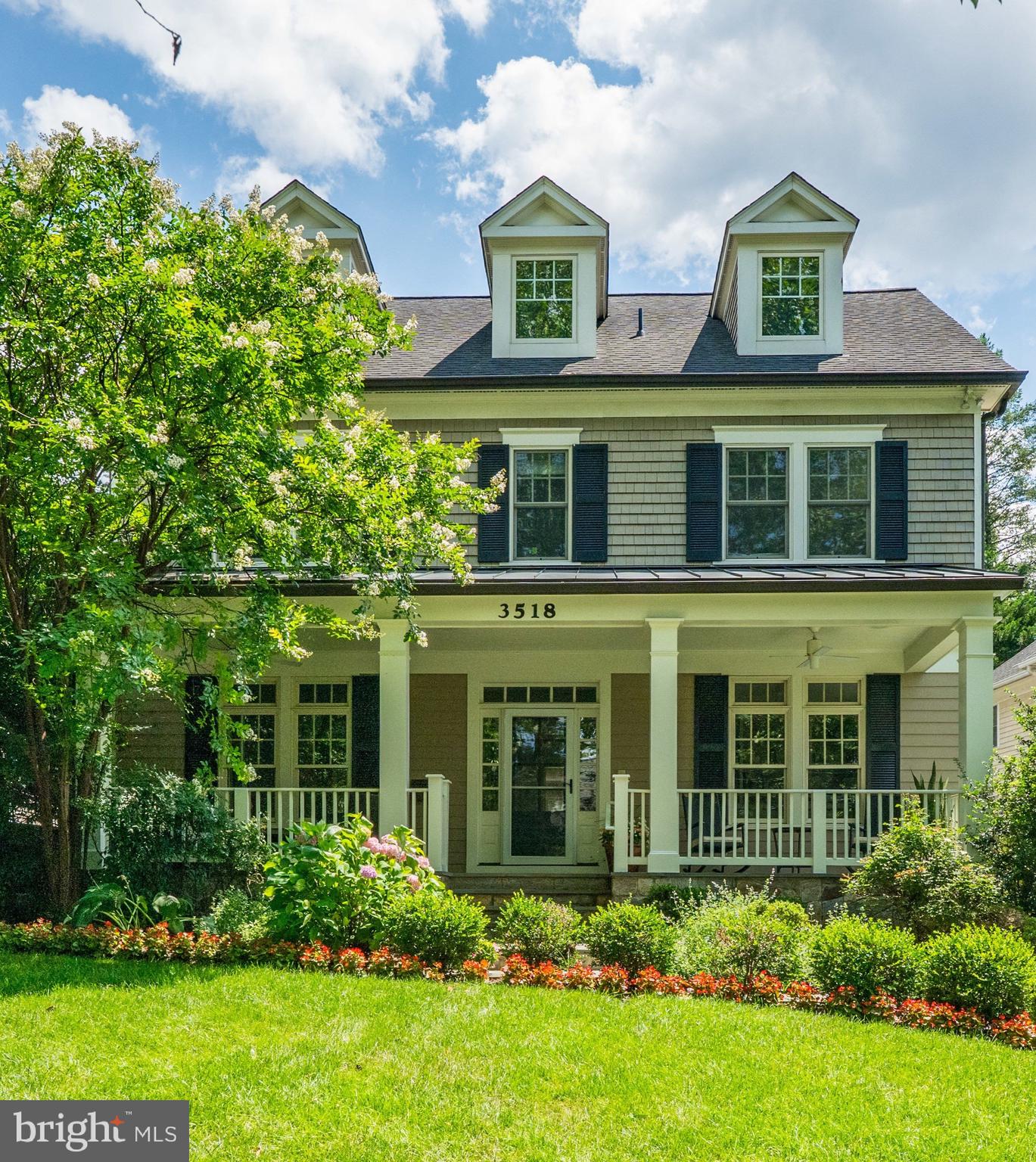 Fabulous Opportunity—Seller has reduced price by $200,000! This classic Chevy Chase home built in 2007 by McCullough Builders shows like a model home! Prime location with Chevy Chase Local Park at the end of the street complete with playing field, playground, tennis court and basketball court. Brookville Market, Pharmacy and other shops conveniently located across the street! From the welcoming front porch to the elegant foyer and entryway, high ceilings, beautiful wood floors, spacious windows and french doors are just a sampling of the fine features found throughout. Custom built-ins, custom lighting, stunning light fixtures and oversized doors add to the quality and luxury that exemplifies the attention to detail in this warm and inviting home. Enjoy coffee or cocktails on the inviting front porch. The open floorplan on the main level provides an extra wide front foyer, beautiful library/office with views of the front porch, elegant living room, and spacious dining room. Continuing through the center hallway you will be delighted with the oversized kitchen with 2 islands and table space for 8 or 10. Top of the line appliances throughout. The grand kitchen opens to the family room with fireplace, adjacent powder room and mudroom, and side entry to the extra long driveway (enough for 6 cars). A 1-car detached garage along with a rear yard complete the main level of this residence.
On the second story, the primary suite offers custom ceilings, 2 huge walk-in closets, a primary bath with double vanities, custom tub and separate steam shower. 3 additional bedrooms and 2 full baths along with a second level laundry room complete this level. A 5th bedroom and 4th bath are found on the top level of the home, along with a huge office/playroom/art studio with more than ample closets and storage. Continuing downstairs to the lower level one will find a 6th bedroom with a 5th bath, exercise room, huge recreation room and separate utility room.
A total of 6 bedrooms, 5 full baths, 1 half bath, 1 car garage and parking for another 6 cars. Enjoy all that Chevy Chase has to offer with the everyday conveniences so close. Turner Lane ends at the park, which limits street traffic and makes outdoor activities a joy.