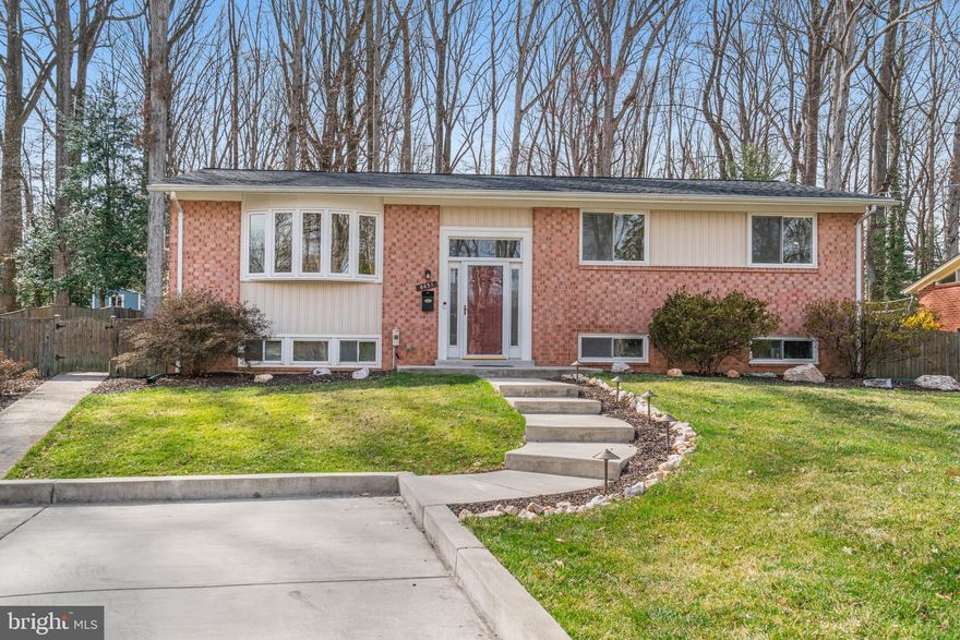 Absolutely Gorgeous Five Bedroom Bright and Cheery Home in Desired Kings Park Neighborhood. One Family Owned Home Backs to Fairfax County Parkland. House Fully Remodeled Down to the Studs in 2009. Fabulous Chef’s Dream Kitchen with Cathedral Ceiling, Recessed and Pendant Lighting, Cambia Quartz Counters, Upgraded Stainless Steel Appliances, Dual Oven Stove, Cherry Cabinets, Designer Porcelain Floor, Large Peninsula with Breakfast/Homework Bar, and Loads of Cabinet and Counter Space. Gleaming Hardwood Floors on Upper Level. Main Level Family Room with Porcelain Floor, Gas Fireplace, Dual Doors Leading to Deck and Backyard, Recessed Lighting, Closet, and Oversized Windows. Cathedral Ceiling in Living Room, Dining Room, and Kitchen. Two Level Foyer. Two Main Level Fully Remodeled Full Bathrooms with Tile to the Ceiling on Tub and Shower Surrounds and Porcelain Floors.  Blinds on Most Windows. Main Level is Wheelchair Accessible with Ramped Sidewalk from Oversized Driveway. Wide Doors on Main Level Bedroom and Hall Bath. Second Family Room on Lower Level – Perfect for Game Night. Two Bedrooms on Lower Level, Wide Hallway, and Full Bath. Fully Remodeled Full Bath on Lower Level with Tile to Ceiling in Shower and Porcelain Floor. Separate Laundry/Utility Room.  Plenty of Closets and Storage Space. Fully Fenced in Yard, Backing to Kings Park Park, with Shed, Gardens, and Deck.  Upgraded Insulation. New Architectural Roof in 2024 with Transferrable Warranty. 100 Yards to 17 G Metro Bus Stop. Plenty of Space to build a Swing Set and Tree House. Can't Beat the Location – Close to Lake Accotink Park’s Two Trail Entrances, Kings Park and Kings Glen Elementary Schools, Easy Access to Kings Park Park with Basketball Hoops, Baseball/Softball Field, Tennis Courts, Playground, and Creek. Close to Rolling Road VRE, Metrobus Stop with Service Direct to Pentagon, Shopping, Public Library, and Neighborhood Pool. Close to I-495, Braddock Road, Ft Belvior, NGA, FFX Parkway - A Commuters Dream! Kings Park is a Sought After, Close Knit Neighborhood Where Neighbors Know Each Other. This House is Move In Ready.