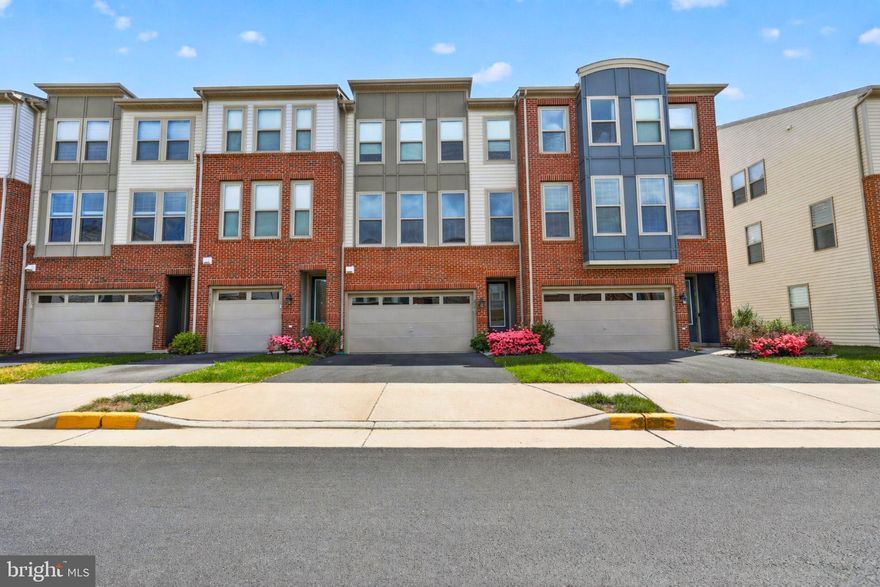 Upgraded 3-level townhome with two-car garage, walkout basement, and prime commuter location.
Modern 3-level townhome with a 2-car garage and open-concept living areas. Ideally located near major commuter routes, the home also features a walkout lower level and easy access to everyday conveniences.
The main level features wide-plank flooring, high ceilings, and large windows that fill the space with natural light. The kitchen offers upgraded cabinetry, granite countertops, stainless steel appliances, and a spacious layout that flows naturally into the dining and living areas. Just off the main level, the rear deck has a comfortable outdoor retreat with a hot tub and fenced in backyard. 
Upstairs, the bedrooms are well-sized, including a primary suite with generous closet space and a private bath. The finished walkout lower level adds flexible living space with a full bathroom, ideal for a guest suite, home office, or recreation area. Additional highlights include a UV air purification system, a recently installed water heater expansion tank in 2024, and numerous upgrades throughout. The garage is also fully finished with shelving. 
Located near Dulles West Boulevard, Route 50, and Arcola Boulevard, commuting is convenient with easy access to major employment hubs, Dulles Airport, and surrounding Loudoun County destinations. 
Shopping, dining, and essentials are just minutes away. Schedule your private showing today and discover everything this home has to offer.

Some images may reflect virtual staging or digital editing, including removal of personal property, to help showcase the home.