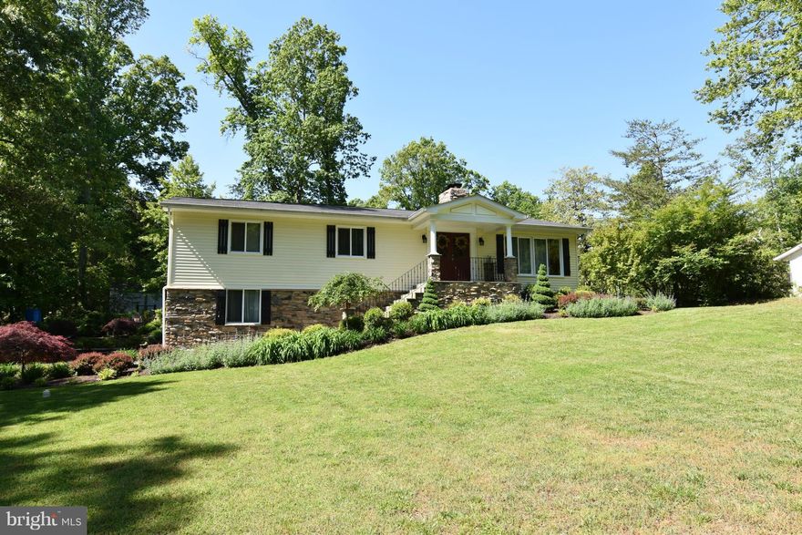 Extensive landscaping and stone work on this gorgeous home. Hardwood or wood laminated floors thru out both levels. Double sided brick fireplace in family room and breakfast nook. Granite counter tops and new appliances. Windows were replaced in 2012 and roof in 2011. Deck and fenced in yard. Basement is fully finished with full bath, large rec room and another wood burning fireplace.