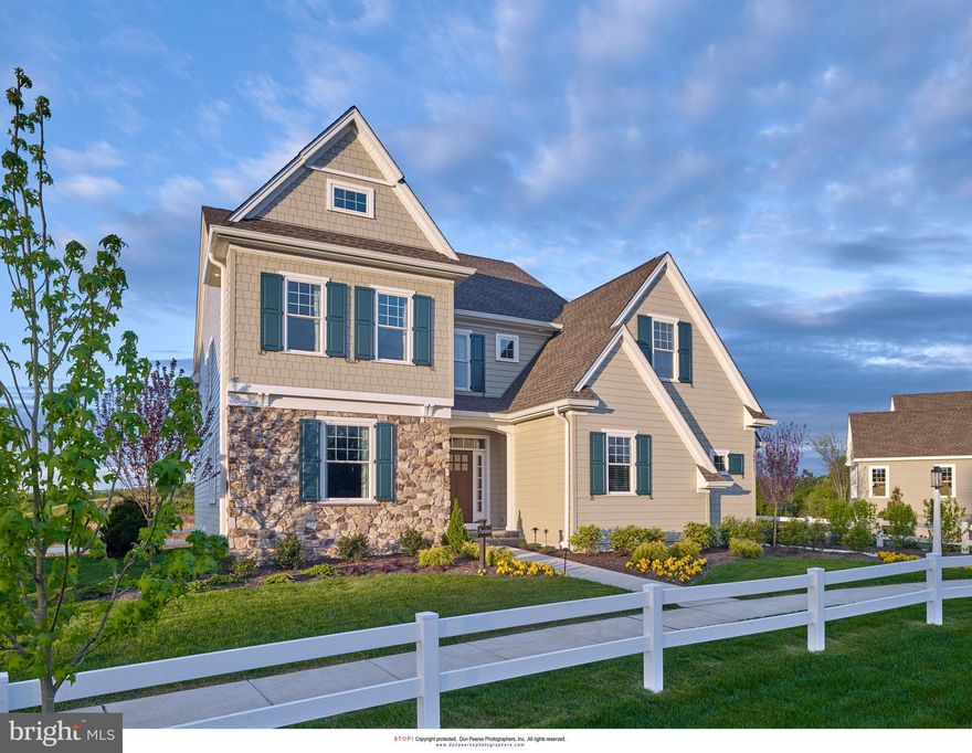 Welcome to the professionally decorated Providence model home in the award winning community of Chapel Hill. This is turn key living at it's best. The transitional floor plan offers three bedrooms, a second floor bonus room, two full baths, formal powder room, three  stop elevator, and a finished basement with a second powder room. This home is located on a premium lot with a walk out lower level opening onto common space.  Many of the features of this home are what you would typically find in a custom home such as site finished hardwood floors throughout the main level and second floor hallway, 9'8" high ceilings on the main level, crown moldings and cased openings, coffered ceiling in the Family Room, solid core doors, transom windows in the doorways on main floor, rounded drywall corners, gas fireplace,  built-ins in the study, and zoned HVAC. The open kitchen features a Bosch stainless steel French door refrigerator, Bosch microwave, Bosch wall oven, Wolf cooktop,  Bosch Dishwasher and upgraded Carrara marble countertops on the island. 1000sf Finished Walk Out Lower Level with additional windows, a powder room and storage area. Beautiful patio with a sitting wall and gas fireplace. Deck.  Two car side entry garage.  The Chapel Hill Homeowners Association Fee includes lawn maintenance, irrigation of the front lawn and beds, mulching and weeding of the front beds, snow removal to your front door and driveway, trash and recycling, and street maintenance. The furniture is not included in the purchase price. The light fixtures shown over the kitchen island in the photos have been replaced.