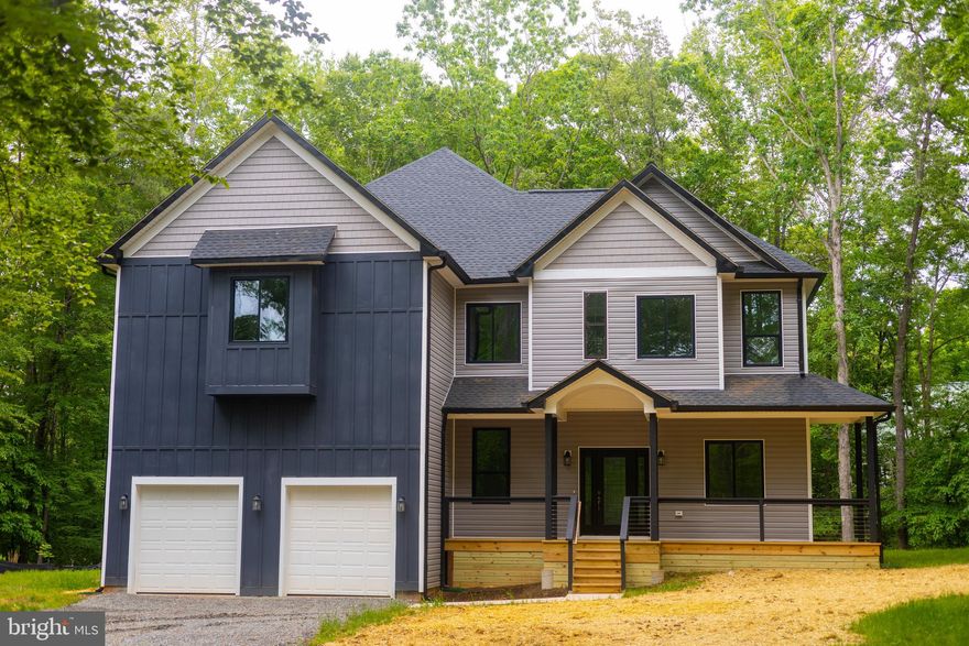 Brand new construction with lake access and your own assigned boat slip (Morgan 2, Pier 2, Slip 7)—a rare opportunity to own nearly 4,000 sq ft of beautifully designed living on over an acre in one of Lake Anna’s most sought-after lake communities.

Inside, soaring ceilings, expansive windows, and a thoughtfully designed open layout create a bright, airy feel from the moment you walk in. The kitchen, dining, and great room connect to form the main living space, bringing in natural light and peaceful wooded views.

The modern kitchen features all-new appliances, quality finishes, generous prep space, and a large island at the center—designed for both everyday living and entertaining.

Upstairs, the primary suite offers a spacious private retreat with an en-suite bath, dual walk-in closets, and an adjoining flex room ideal for a nursery, office, or sitting room. Two additional bedrooms are connected by a Jack-and-Jill bath, offering a practical layout for family or guests.

The main level adds even more flexibility with an additional bedroom, full bathroom, and dedicated office or study, making it ideal for guests, working from home, or multi-generational living.

Beautifully built with quality craftsmanship throughout and designed with both space and function in mind, this home offers the best of new construction and lake living.

Long lake days. Sunset boat rides. Brand-new construction without the wait. Ready for summer.