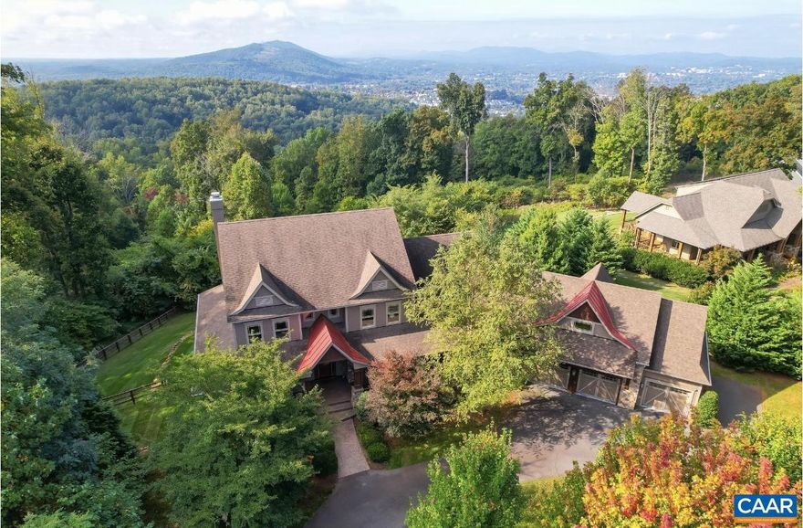 Breathtaking Monticello Mountain views are enjoyed from this exquisite five bedroom ASHCROFT residence situated on 1.44 very private acres. Artistry and Architecture are found on all three levels. 10', coffered, beamed and unique barrel ceilings add to the warmth and style found in every room. Extensive use of hand crafted rare woods, exotic granites, custom stain glass, custom built-in's, designer lighting and customized iron work by Stokes of England found throughout. Two very spacious Master suites with spacious walk in wardrobes, and enormous picture windows. Terrace level is a dream, featuring a cork floored wine room with 400+ bottle capacity, full bar, 60" linear fireplace, exercise room, full bath, enormous storage and an under cover patio that will take your breath away. The covered front/back porches with wrap around decking are phenomenal. Privacy abounds from the expansive back yard and on both sides of the maturely landscaped grounds. Sunset views over Monticello are paramount to this property. Expansive 3-car garage. Ashcroft features 974 acres of Virginia Mountain Ridges with 107 Acres of Dedicated Nature Preserve. Just 5 minutes to  Sentara Martha Jefferson hospital & shopping. See floor plans in documents.,Glass Front Cabinets,Granite Counter,Wood Cabinets,Fireplace in Basement,Fireplace in Great Room