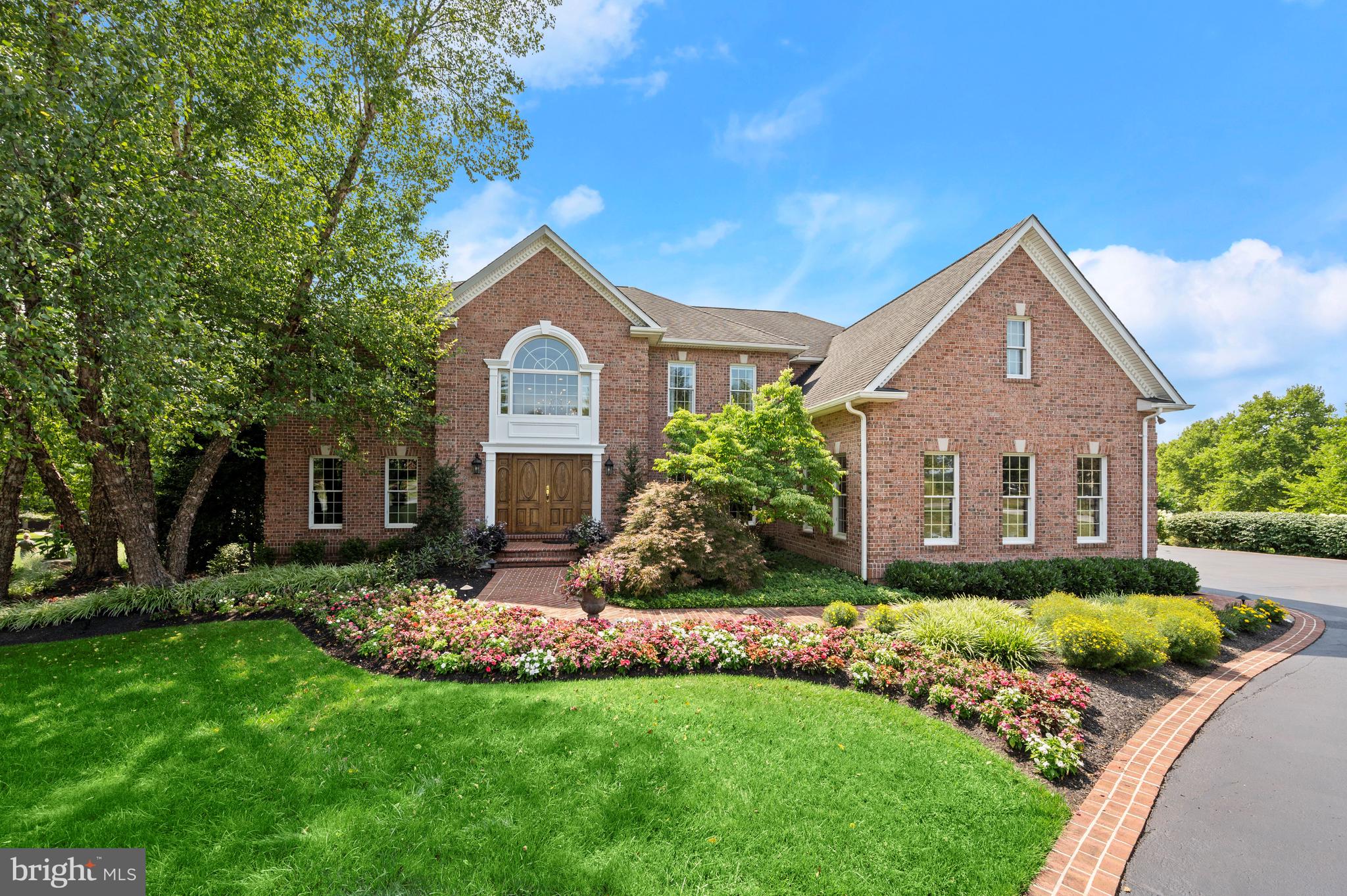 Discover luxury living at 3595 Willow Birch Drive! Situated on a corner lot spanning 1.13 acres of lush landscape with enchanting landscape lighting, this brick masterpiece stands proudly within the esteemed Cattail Creek community. Boasting 6 bedrooms, 5 full baths, and 2 half baths across 3 exquisite finished levels, this residence offers an unparalleled blend of sophistication and comfort. This homesite is conveniently situated across from Cattail Creek Country Club, a private country club with award winning golf, tennis, pool, restaurant, fitness center, and playground. With the benefit of no HOA in this premiere community, Cattail Creek Country Club is optional to join. An awe-inspiring interior is introduced by a grand 2-story foyer boasting twin curved staircases, marble floor, and custom millwork that captivates the eye. Brazilian cherry hardwood floors with intricate inlay sets the stage for elegance throughout. Whether you're hosting a formal dinner or enjoying a quiet evening with loved ones, the formal living and dining rooms with decadent details including crown molding and wainscoting offer the perfect backdrop for your lifestyle. The gourmet eat-in kitchen is fit for a culinary enthusiast, featuring granite counters, 42-inch cabinetry with undermount lighting, a tiered island with prep sink, tile backsplash, and top-of-the-line stainless steel appliances including a gas cooktop with range hood and built-in SubZero refrigeration drawers for added convenience. Cozy sunroom off the kitchen, complete with a gas fireplace overlooking your scenic backyard. The show stopping 2-story great room offers an abundance of natural light through stacked and Palladian windows, complemented by built-ins and a second gas fireplace. Main level study with elegant French doors, providing a private workspace. Convenient laundry room and mudroom combination designed for functionality. Two thoughtfully designed half baths on the main level for your guests' comfort. The primary bedroom is a true sanctuary, boasting a spacious layout and a tranquil atmosphere. It is graced with a tray ceiling and a sitting room. The attached bath is a haven of relaxation, boasting separate vanities, a tiled Roman shower with frameless glass door, a soaking tub, and a custom built-in coffee station. Your walk-in closet is adorned with built-in dressers. An additional 4 bedrooms and 3 full baths provide luxury and comfort for the entire family. The lower level is an entertainer's dream. The expansive recreation or media room is perfect for indulging in your favorite TV series or hosting a game night with friends. The lower level also features a wet bar with refrigerator and a spacious playroom, perfect for home or virtual schooling or creative endeavors, complete with built-in cabinetry, desks, and storage. An inviting 6th bedroom with a walk-in closet and attached full bath provides privacy and comfort. The lower level walkout allows for seamless indoor-outdoor flow with a sliding glass door to the patio. Your very own sanctuary awaits, adorned with professional landscaping that invites you to experience nature's beauty in harmony. As day transitions to night, the landscape lighting casts a mesmerizing glow over your corner haven, creating an ambiance that's nothing short of magical. Step onto the deck that overlooks your sprawling backyard and charming storage shed. This space offers endless possibilities for outdoor entertainment, relaxation, and enjoyment. This home is more than just a residence; it's a work of art, a haven of comfort, and a testament to your lifestyle.Property Updates: (3) HVAC units replaced with smart thermostats with high seer (16) York units, Upper level air handler cooling and electric heat coils, well pump, well pressure tank and controls replaced, water heaters (2) 50 gallon each replaced, Sub-Zero refrigerator door seals and compressors, 12.6KW Solar panel system, carpet, interior paint, landscape lighting replaced, and more!