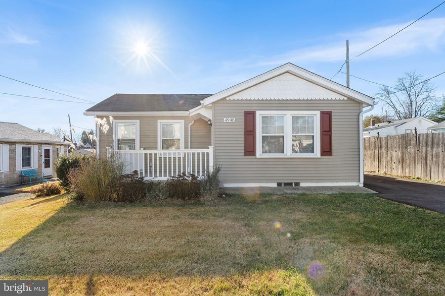 Welcome to 4948 Greenwood Street, a beautifully updated 2-bedroom, 1-bath home that blends comfort, convenience, and modern style on a quiet street with a level, spacious lot. This charming property features a welcoming front porch, newer vinyl siding, central air, and gas heating, plus extensive 2025 upgrades including all-new flooring throughout, a brand-new driveway, fresh interior paint, recessed lighting, new closet doors, new closet shelves, new closet lights, a new bathroom sink, new kitchen countertop, new dishwasher, a new gas stove, new range-hood vent, new refrigerator, and new sliding door. The warm and inviting living room leads into a long, spacious kitchen with attractive easy-care backsplash, stainless steel sink, and newer cabinetry. The updated bathroom features a tiled shower with a modern fixture, and the partially finished basement with tile flooring offers additional storage. A new sliding door opens to the rear deck overlooking a lovely yard—an ideal spot for morning coffee or evening relaxation—while the driveway accommodates up to four vehicles. Conveniently located near I-95, public transportation, and shopping, this move-in-ready home offers modern amenities in a peaceful setting. *** Some of the pictures are virtually staged. Actual décor and furnishings may differ from what is shown in the photos. Don’t miss the chance to make it yours!