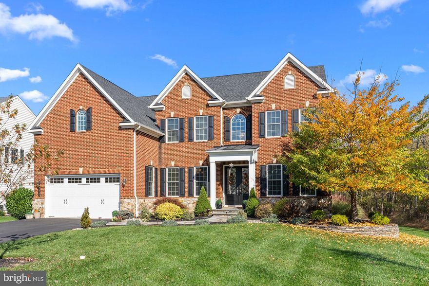 Enter this spectacular home from the covered front porch into the entryway which features a grand two story foyer with beautiful staircase and rich hand scraped hardwood floors. This traditional floor plan offers a formal living room and dining room as well as a private office just off of the foyer entry. There are 10 ft ceilings on the main level and an expansive vaulted ceiling in the family room. The family room is sundrenched and has a gas fireplace. The kitchen is a chef's dream with its double oven, gas cooktop and large island with seating and extra storage. The 42" cabinets and granite counters have all been upgraded. There is a small bar setup and coffee nook along with access to the second floor via the split staircase. All the rooms on this level have been bumped out by the builder to offer even more room to spread out. The current owners recently added a 2 level no maintenance deck for even more entertaining space right off the dining area of the kitchen. There is a walk-in pantry, a large closet for storage or additional pantry and a mudroom with built-ins that exit to the 2 car garage. Upstairs you'll discover the  the remarkable Owner's Suite. It is sure to  impress you with it's large double walk in closets, spacious layout and adjoining luxury full bath with European spa shower and soaking tub. The sitting area is a cozy spot to relax and exits to an outside balcony style deck. There are an additional 3 large bedrooms, full bathroom and laundry room off of the upstairs hallway that overlooks the family room and foyer.  The basement is HUGE and finished. It is partially carpeted for a lounging area, while the adjacent side has recently installed waterproof wood flooring and is set up (plumbing included) for what could be an amazing bar area. The additional full bathroom on this level has a zero entry shower. It was added in 2019. There is a large storage room and a separate studded area that was intended to be a media room or fitness area by the current owners. It only needs drywall to be complete. The basement has stairs that exit to the side yard. The side and back yards are private and offer wooded views. Just minutes from many major roadways and also conveniently located near the Shoppes at Valley Square, Wegmans, and historic Downtown Doylestown, makes this location perfect. This beautiful home is only 6 years old and the current owners have not only finished the basement and outdoor space  but added many additional upgrades. Just move in and enjoy!