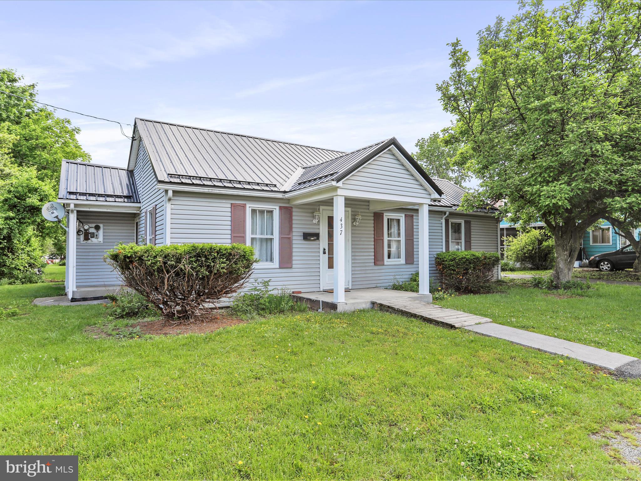 Don't wait to check out the cutest little home you're going to find on the market at this price! This 2 bedroom, 1.5 bath is just what you're looking for. The home offers an additional bonus room that can be made into a home office, additional storage space, walk in closet, etc. with a nice pantry space off the kitchen, a full attic to give ample storage and a detached garage space. New metal roof, range and built-in microwave, and fresh paint and the beautiful maple hardwood floor, this one is ready for you to add your finishing touches and move in!