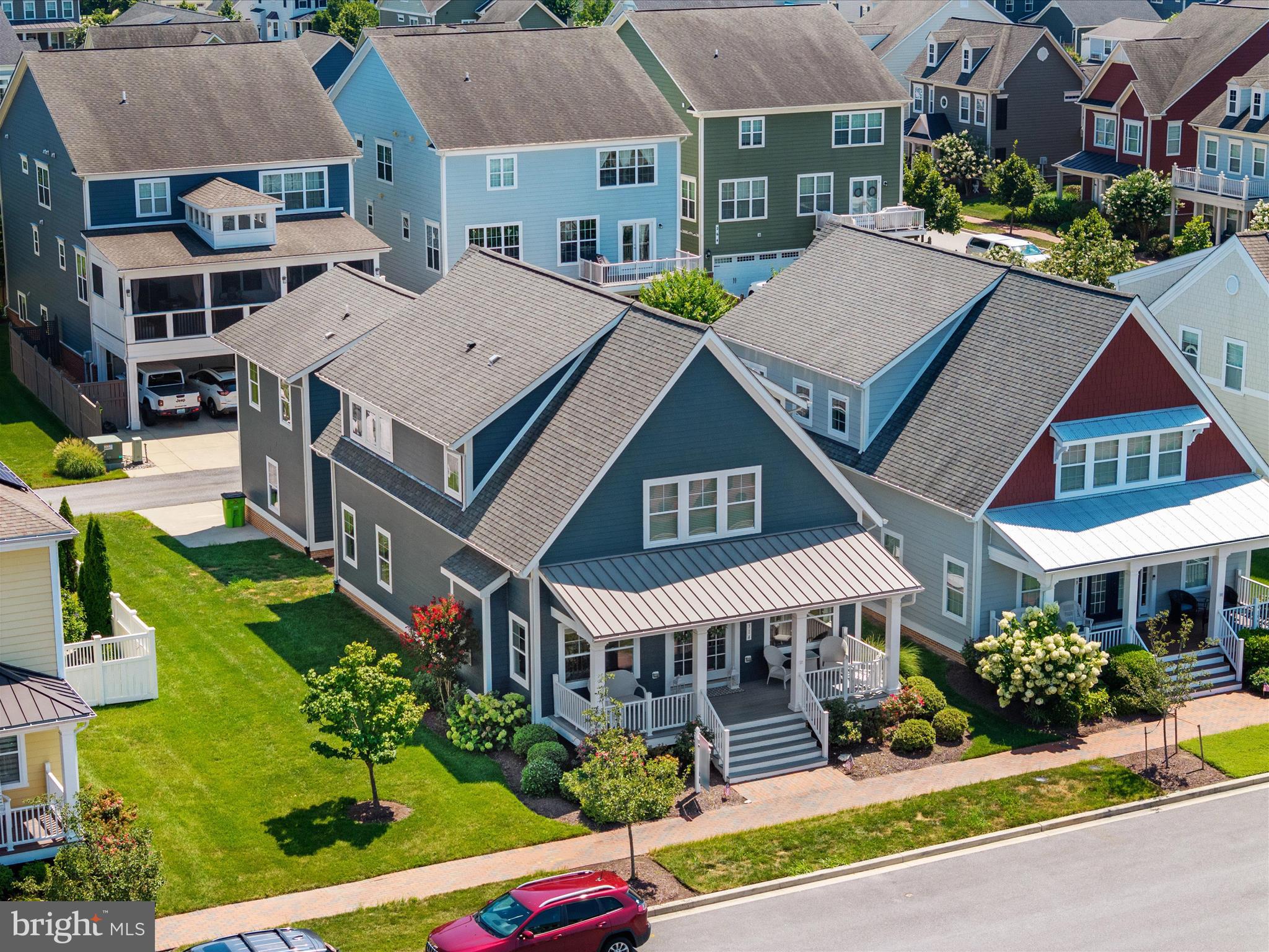 WOW! this is your opportunity to get into this sought after community for UNDER $800k! Welcome to 314 Thomas White Blvd. Nestled in the sought-after waterfront community of Gibson’s Grant, this 4-bedroom, 3.5-bath home offers the perfect blend of refined living and relaxed coastal comfort. You will fall in love with the inviting front porch to the detached garage with the 4th bedroom and 3rd full bath over top. The oversized lot offers space for you to create your private oasis while every detail has been thoughtfully curated. The main level is filled with natural light, gleaming hardwood floors, and a versatile office—ideal for remote work or a cozy reading nook. The gourmet kitchen is an entertainer’s dream, complete with white cabinetry, granite countertops, and high-end appliances that flow effortlessly into the open-concept dining and living spaces. Upstairs, the spacious primary suite stuns with vaulted ceilings, a spa-like ensuite, and generous closet space. Fresh carpet in the guest rooms adds a crisp, turnkey finish. Step outside and enjoy the beauty of one of Kent Island’s most beloved communities—complete with a clubhouse, outdoor pool, walking trails, kayak launch, playgrounds, and easy access to the Bay Bridge. Luxury, lifestyle, and location—this is the one you've been waiting for.