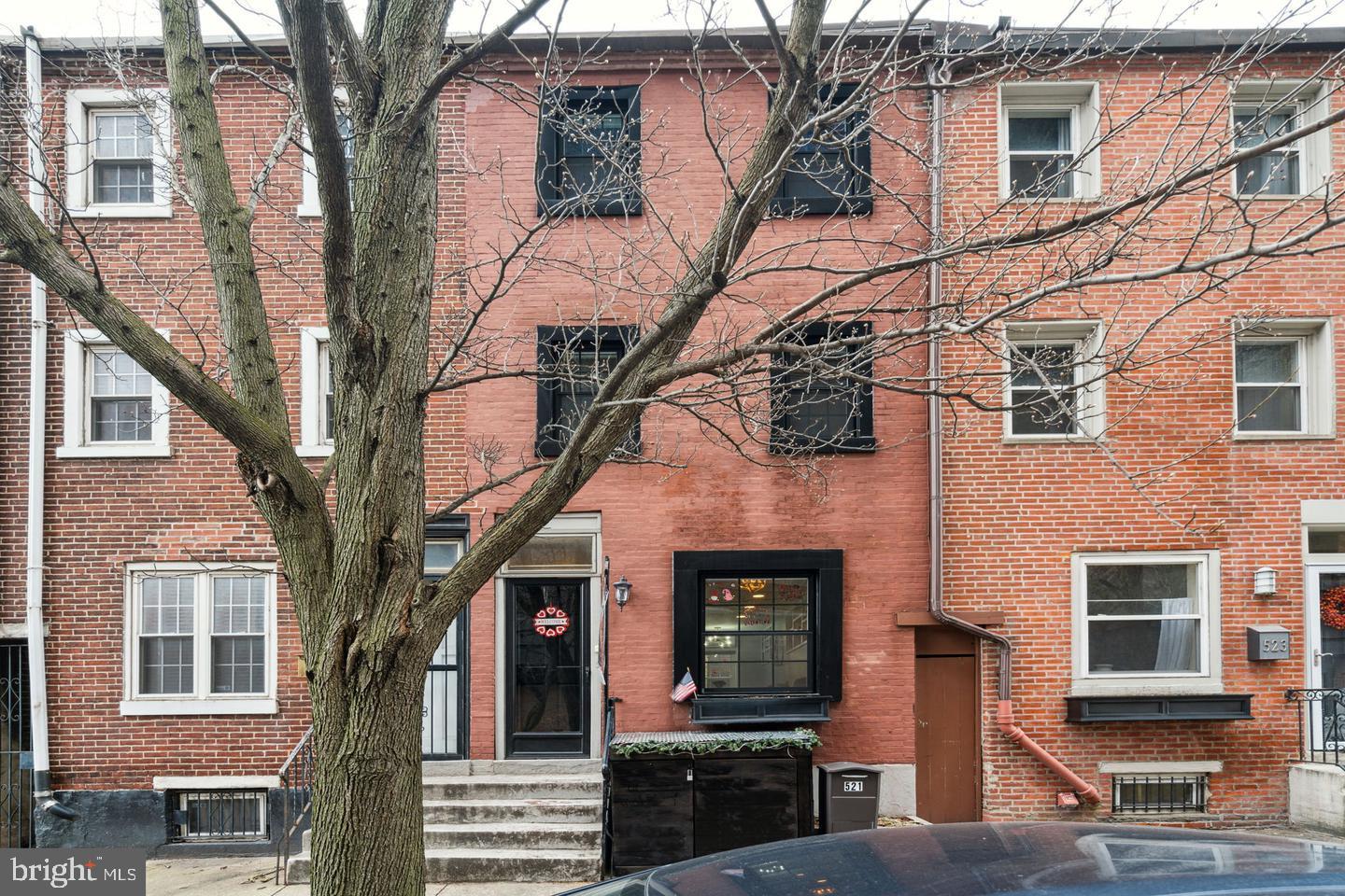 Open House for 4/27 has been cancelled** Welcome to 521 S 27th Street! This beautiful 2 bedroom + den/office, 1.5 bathroom home resides in the highly desirable Fitler Square neighborhood of Philadelphia and in the Greenfield Catchment. Upgrades to the home include new windows on the first floor and front of the home, ductless HVAC, decking on the back patio, recessed lighting, and a new back door. As you enter the home, you will immediately notice the hardwood flooring throughout the spacious living area. Make your way to the kitchen featuring stainless steel appliances, subway tile backsplash, white cabinetry and access to your adorable private patio! Make your way upstairs to the primary bedroom with large closet and custom shelving. Through the closet you will find the primary bathroom boasting a large vanity with tons of under sink storage! Upstairs to the third floor is your spacious second bedroom, allowing for an extra bedroom, nursery, home office, or home gym. 521 S 27th Street is complete with an unfinished basement and shed, perfect for extra storage space and storing a stroller or bikes! Located in a quiet neighborhood, blocks from the gym, multiple grocery stores, a local butcher, Cafe Lutecia, coffee shops including Rival Bros, Starbucks & Row Home Coffee, the Amazon Center, and 5 parks perfect for all ages of children. Easily accessible to the South Street Bridge, Hospitals, Universities, & 76, less than 15 minutes from the airport, 5 minute drive to 30th Street Station and close to the Schuylkill River Trail and dog park. This home is in a perfect location! Schedule your showing today.