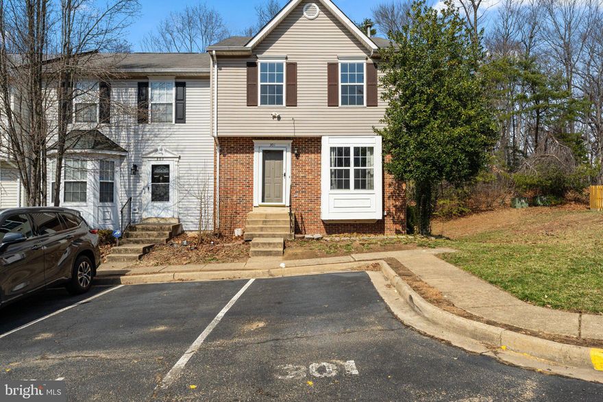 This beautiful end unit  has new  carpeting   and fresh on two levels paint among other updates. The main level has hardwood floors and the basement offers a wood fireplace.
Two primary suites upstairs , walk out basement with a den, full bath in the basement. Deck out of the kitchen. Power room on the main level- Ready for the new owner