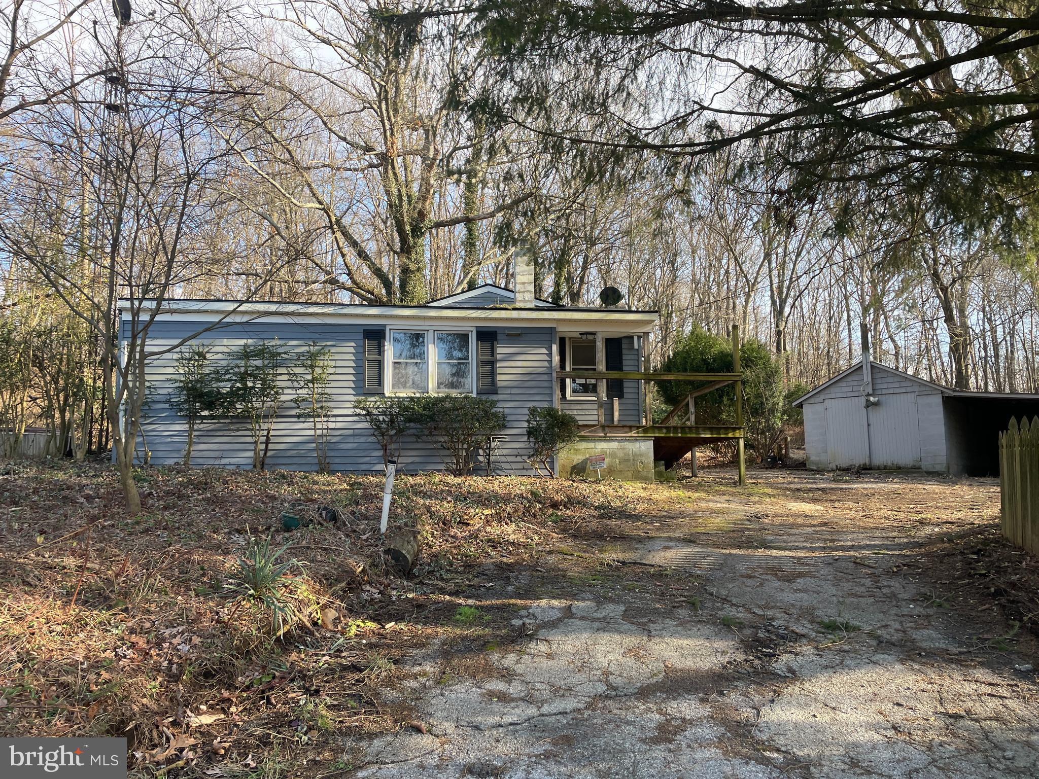 Ultra rural setting just south of the Pennsylvania line perfectly suited for someone who wants privacy and someone who needs shop or garage space! Check out this very private, cozy little cottage situated on a private wooded lot that offers a few outbuildings garages and carports for your collection of mechanical equipment or vehicles. Inside, you will find a spacious newer addition located at the rear of the building with an extra deep basement that could be built out as a giant family room. Tons of good space down here.
Upstairs, you will find one level living with two oversize bedrooms and a front deck that overlooks the valley across the street. Sit out and watch nature unfold this spring ! Lots of potential for a Northern Baltimore County getaway or enjoy your country scenery on your trip out to this serene part of the region. It's just plain beautiful out here !