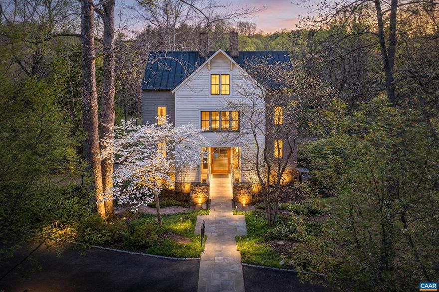 Open House Sunday 19th from 10-4. Architectural masterpiece set on nearly 5 private acres in Inglecress, ideally positioned at the end of a peaceful cul-de-sac. This 4,432 SF custom home, fully reimagined by Alexander-Nicholson, offers 4 bedrooms, 3 full and 2 half baths, and striking modern design with exceptional craftsmanship throughout. A dramatic mahogany pivot door opens to sun-filled interiors with soaring ceilings, sleek steel-and-oak staircases, and walls of glass framing sweeping pastoral and wooded views. The chef?s kitchen features Thermador appliances, marble waterfall counters, and custom cabinetry, flowing seamlessly into expansive living and dining spaces with multiple fireplaces and a NanaWall system opening to an elevated deck. The luxurious primary suite is a private retreat with French doors overlooking Ivy Creek and a spa-inspired bath. A vaulted guest suite crowns the top floor, while the walkout level offers a family room, wet bar, and 2-car garage. Elevator and whole-house generator. Enjoy park-like grounds with fire pit, trail access, and 825 ft of waterfront.,Marble Counter,Wood Cabinets,Fireplace in Family Room,Fireplace in Living Room