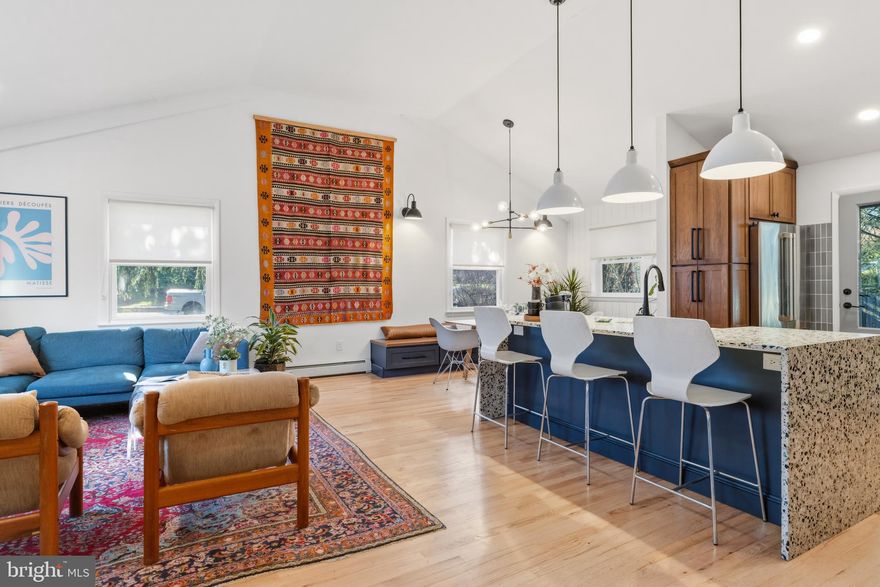 For those who wonder if they could ever find a perfect sized, contemporary split-level in Mt. Airy with a large yard, look no further. With attention to its mid-century architecture, the current owners have made significant renovations that create an amazing home. Designed by Airy Kitchens, the open first floor provides  a vaulted ceiling, living room, and custom kitchen with two toned cabinets, Terrazzo counter tops, Heath tile,Cafe series appliances, Kohler sink, custom lighting, built-in seating bench, and mimi-split a/c. Just a few steps up and you will find an ample  main bedroom with great closet space and en-suite bath, two additional spacious bedrooms, and a new custom hall bath with Fireclay tile, custom cabinetry, Kohler tub, and radiant floor heating. A newly carpeted lower level den with a working fireplace, built in shelving, and door to the back terrace provides essential space for cozy hang outs or ruckus play! This level also includes a bonus room that makes for a great office or potential additional bedroom, laundry room, half bath, and below, a large basement space with high ceilings. The yard is fenced and well planted with mature perennials, and can accommodate the largest of gardens, gatherings, pets, and play. This home has new windows throughout the first floor, most of second, and the exterior was freshly painted in 2022. So much to offer, and just a few blocks to the train to center city, Germantown Ave, and she shops and restaurants of Mt. Airy and Chestnut Hill.