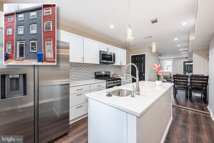 SIMPLY CHARMING HOLLINS MARKET RENOVATION WITH 3 FINISHED LEVELS OF LIVING SPACE AND A LARGE REAR YARD!  Features include wood flooring throughout, an inviting living room with a dining area, gourmet island kitchen with Quartz counters & ss appliances, 2nd level with 2 bedrooms, 1 full bath, and convenient bedroom level laundry, 3rd level Primary bedroom suite with a full bath, unfinished basement that is perfect for storage, and a spacious rear deck that overlooks the backyard with a privacy fence.  Conveniently located close to stadiums, UMMC, downtown Baltimore, and major roadways!