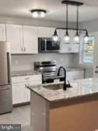PLEASE READ***MINIMUM OF A 640 CREDIT SCORE REQUIRED*****Welcome to this beautifully renovated 3-bedroom, 2-bathroom rowhouse located in the peaceful and sought-after Loch Raven community. This spacious home blends modern upgrades with classic charm, featuring gleaming hardwood floors, granite countertops, and stainless steel appliances in a sleek, updated kitchen. Enjoy the comfort and convenience of a fully finished basement perfect for a family room, office, or additional living space as well as a full-size washer and dryer. Both bathrooms have been tastefully updated, and all three bedrooms offer generous closet space and natural light. Additional highlights include: Off-street parking, Private backyard space, Energy-efficient windows, Central heating and cooling. Ideally situated near parks, shops, and public transportation, this home offers the perfect balance of neighborhood tranquility and city accessibility. Don't miss out schedule your tour today!