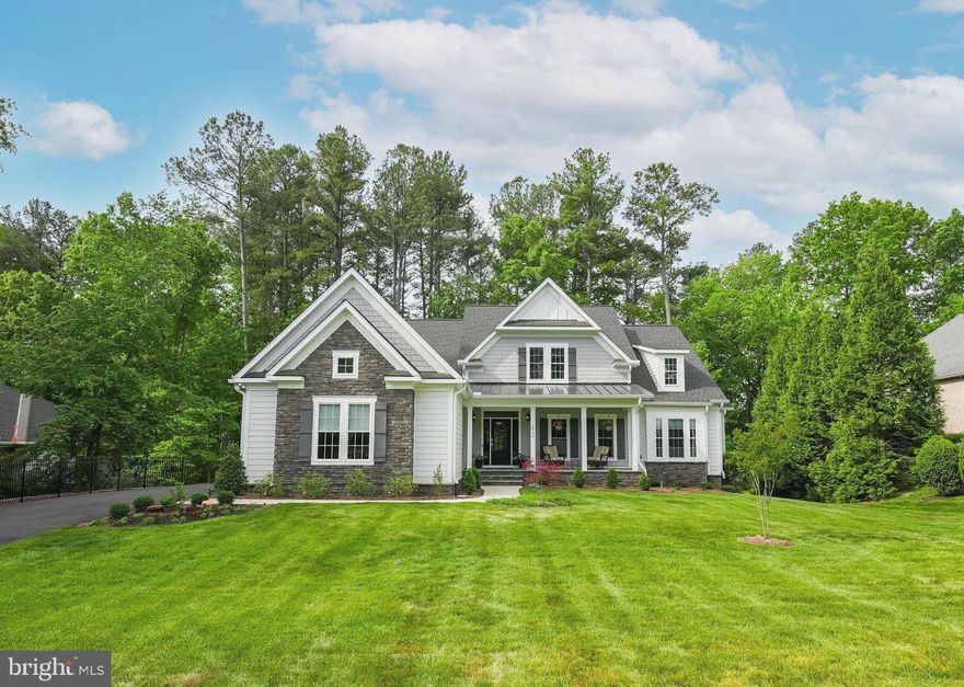 Along the 15th hole of the Fawn Lake Golf Course, timeless elegance meets Craftsman charm in this practically new Dream Home by renowned builder, Simply Home.  This customized Chestnut Cottage model features a desirable modern open floor plan with thoughtful architectural details, and gorgeous hardwood floors that flow through most of the main level.  The gourmet kitchen offers upgraded, soft-close cabinetry, quartz countertops,  stainless steel appliances, under cabinet and kick plate lighting,  walk-in pantry with organizational shelving, and a massive kitchen island perfect for gathering in the hub of the home with family and friends.  A grand, stone gas fireplace serves as the focal point of the family room, accented with built in media cabinets.  In the primary Owner's Suite, you will find a beautiful tray ceiling, two walk in closets, and a luxurious bath complete with double vanities and large shower tiled all the way to the 9’ ceiling.  A second, spacious bedroom is found on the main level offering a cozy, sitting area and convenient, private bath.  Completing the main level is an inviting home office, powder room, and substantial laundry room with utility sink and storage cabinets.  Upstairs, a loft space offers a comfortable retreat for binge watching television or could be a fantastic additional office or study space.  Two more bedrooms with private bathrooms finish the upper level.  A walkout level basement already includes the plumbing for a full bathroom.  Living space extends outside to the large screened porch off the living room on the main level with a second beautiful, stone fireplace and custom, upgraded wooden ceiling.  The porch leads to a Trex deck outside with steps descending to the yard below, leading to the slab patio accented with stone wing walls.  Backing to the picturesque pond along the 15th fairway of the Fawn Lake golf-course, 10704 Chatham Ridge Way is a rare opportunity to own a nearly new custom dream home in this sought-after gated community.  Additional upgrades such as a spacious 3 car garage, Generac generator, and state of the art irrigation system that even waters your hanging plants and containers on the porch!  High-end features and craftsmanship are found in every corner of this beautiful home.  **Located in Fawn Lake, a resort-style gated community with luxury amenities such as a 288 acre recreational lake, beach, marina, Club House, pools, miles of walking trails, soccer field, tennis, pickleball,  baseball field,  basketball, dog park, playgrounds, Country Club, Restaurants and so much more!