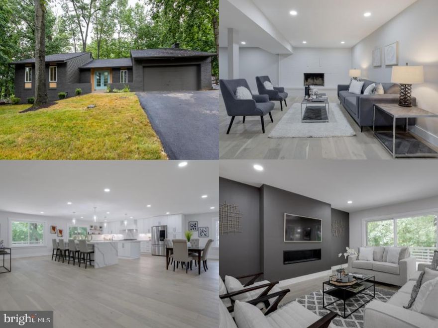 Do you like CONTEMPORARIES? Do you like (almost) BRAND NEW EVERYTHING?  Floors, appliances, showers, roof, kitchen - and it is BREATHTAKING!!!  Come see this cul de sac contemporary with designer features inside and out. The front entry has been accented with a modern turquoise door and is surrounded by cedar plank trim. Inside, the open concept seems to never end, with gleaming hardwoods flowing through the space. Family room features a modern gas fireplace and the latest idea in TVs - the Picture Frame Art TV - where you personalize the frame with artwork you love. Kitchen has dueling islands, great for prep and seating space! Updates include white Shaker cabinets with quartzite counters (soft close of course), wine fridge, custom pull out cabinets, and stainless steel appliances including a Smart refrigerator and a Zline 7 burner range. Open shelving in the kitchen rolls into the dining area, perfect for entertaining!  There is a convenient half bath and door to the 2-car garage next to the dining area. Sliding glass doors open to the new concrete deck, overlooking young trees that will provide many years of privacy as they mature. Down the hall, the grand primary suite awaits. The spacious bedroom is filled with natural light and has a cavernous walk-in closet. Spa-like primary bath is a dream, featuring walk-in shower with bench seat, custom designer tile, glass (coming soon) side and rainshower/regular shower heads. Double sinks offer plenty of elbow room for the morning rush, and luxurious garden tub is ready to help melt away the stress at the end of the day. Two secondary bedrooms, with large closets, and another newly renovated full bath complete the main level.
Downstairs, the expansive family room with another fireplace is perfect for the crew or gatherings. The wet bar with second wine fridge allows for easy entertaining.  Bonus room can be used for home office or great yoga studio! Bedroom 4 is tucked away in the back corner, offering privacy for guests or au pair space. The incredible full bath features bold designer tile in the new walk-in shower (glass is forthcoming here). Large unfinished space can function as a home gym or a great home theater - and has its own walk-up side entrance.  Location, location, location: Minutes from 495 express at Gallows Road, INOVA Fairfax, Mosaic District, only 10 minutes to Tysons. This home, situated near the end of a quiet Cul de sac, is perfect to create memories that will last a lifetime.