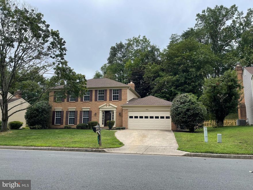 Very well maintained 4 bedroom brick colonial with excellent curb appeal and wooded private back yard.
Main level boasts engineered wood flooring, and ceramic tile kitchen and laundry room.
Family room with wood burning fireplace has been freshly painted, and is off the kitchen area.
Home is of a neutral decor throughout and move-in ready.  
Eat in kitchen boasts granite countertops and plenty of cabinetry and is fully equipped with refrigerator w/icemaker, built in microwave, self cleaning oven and dishwasher.
Upper level has 3 generous sized bedrooms plus primary bedroom and ensuite bath.  Hall bath on upper level is full and main level boasts powder room.
Excellent location, schools, amenities and so convenient to shopping, bus, commutor lot, and more.
Homes shows well and has been very well maintained and improved over the years.